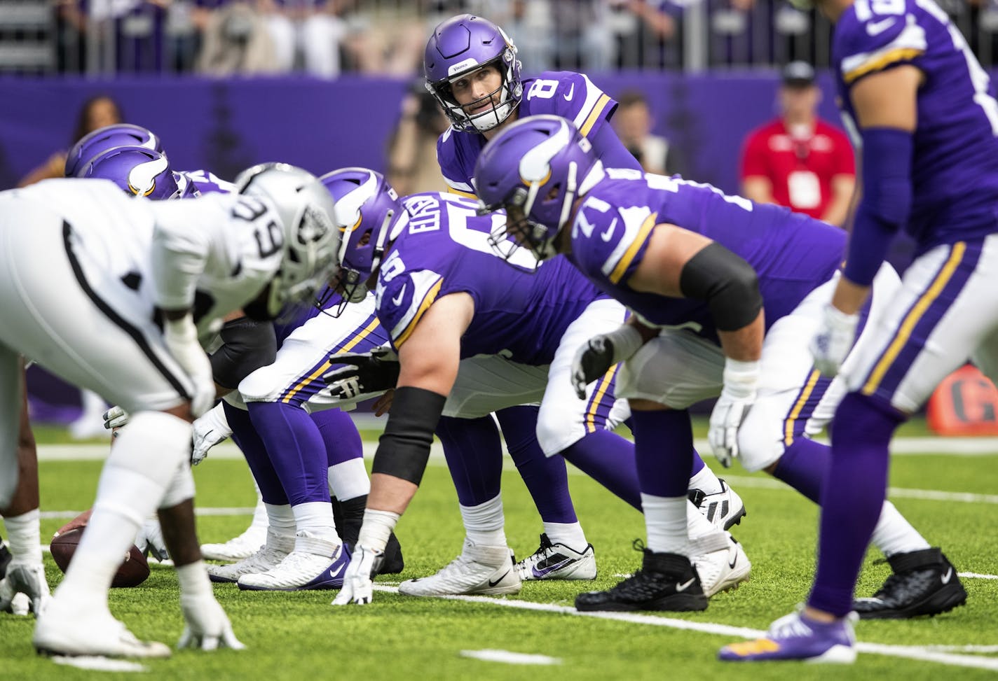 Minnesota Vikings quarterback Kirk Cousins (8) and offensive line.