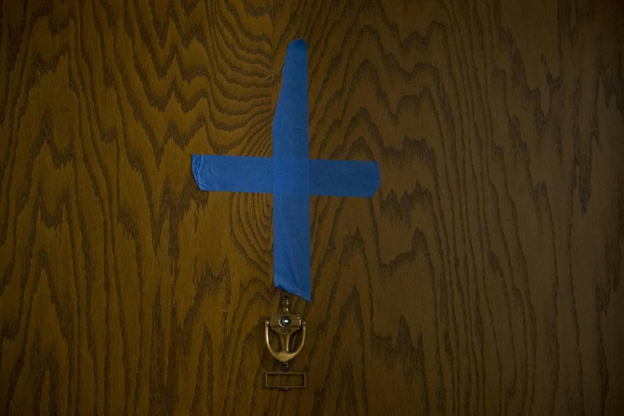 Blue crosses of tape are placed on different apartments that are being reapaired in a 1960s' era apartment complex, Wednesday, January 29, 2020 in New Brighton, MN.