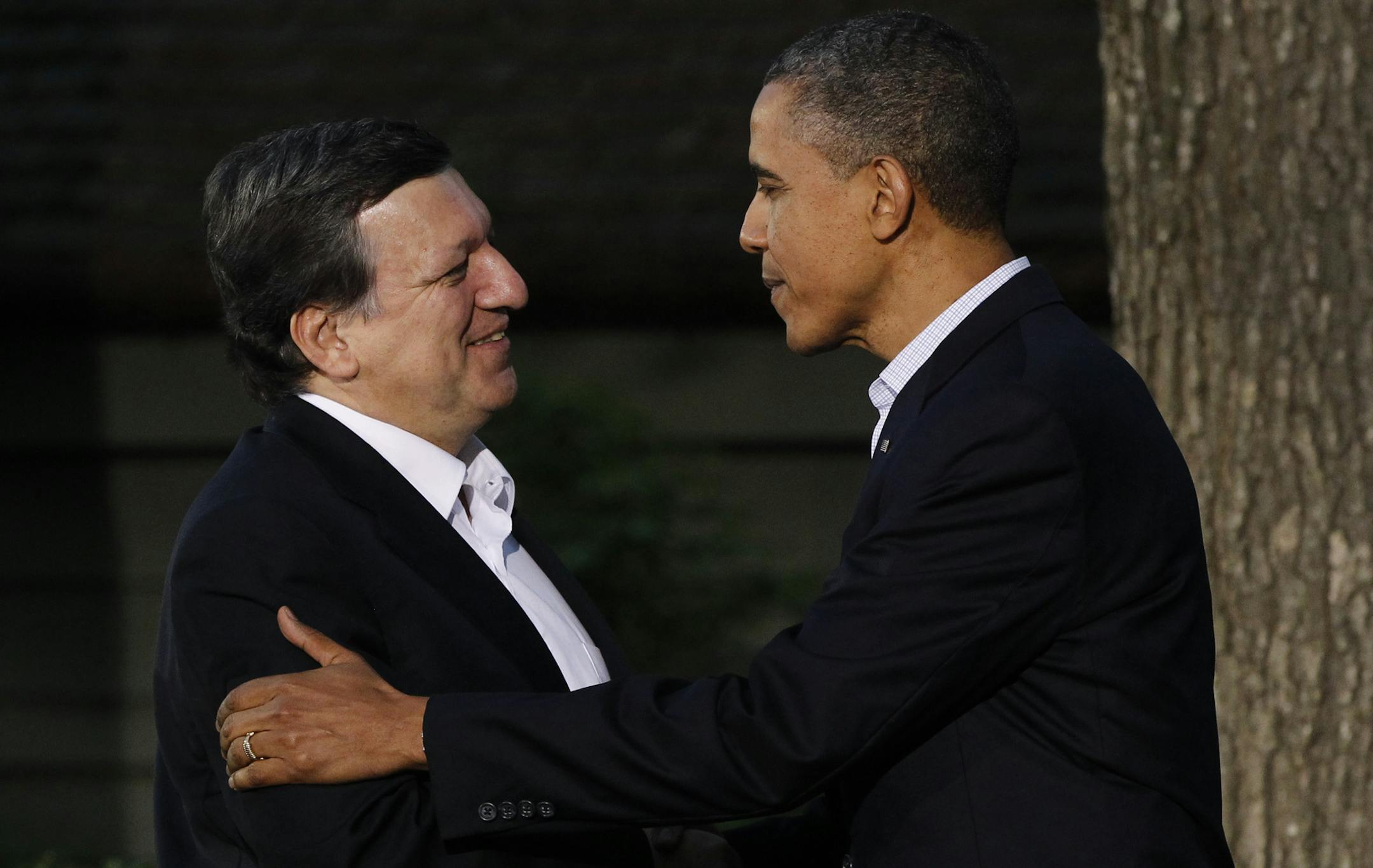 FILE - This is a Friday, May 18, 2012 file photo of President Barack Obama, right, greets President of the European Commission Jose Manuel Barroso on Barroso's arrival for the G8 Summit at Camp David, Md. The backlash in Europe over U.S. spying is threatening an agreement that generates tens of billions of dollars in trans-Atlantic business every year _ and negotiations on another pact worth many times more. (AP Photo/Charles Dharapak, File)