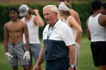 Becker High School long time football coach Dwight Lundeen spoke to the team during practice in Becker, Minn., on Tuesday, August 24, 2021. Lundeen is