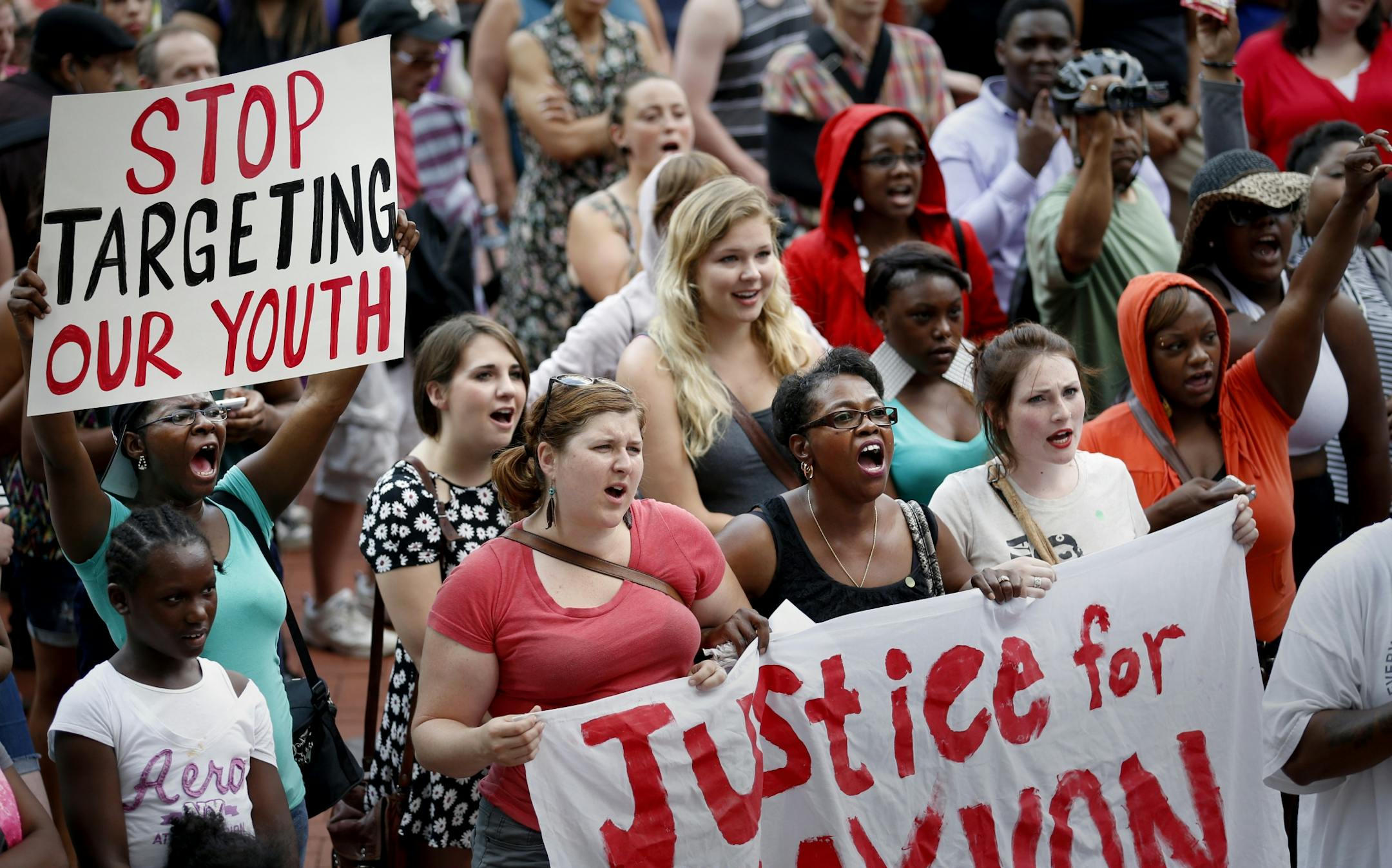 The crowd cheered during a Hoodies up for Trayvon rally at the Hennepin County government center in Minneapolis on Monday.