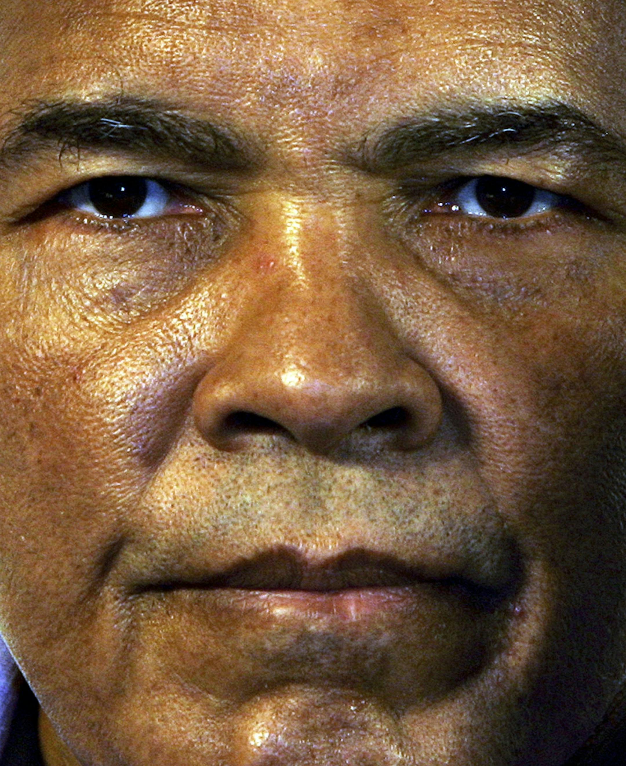 Former heavyweight boxing champion Muhammad Ali poses during a news conference in Berlin Friday, Dec.16, 2005. Ali is in Berlin to be awarded with the Otto-Hahn peace medal and to attend the fight of his daughter Laila on Saturday Dec. 17.