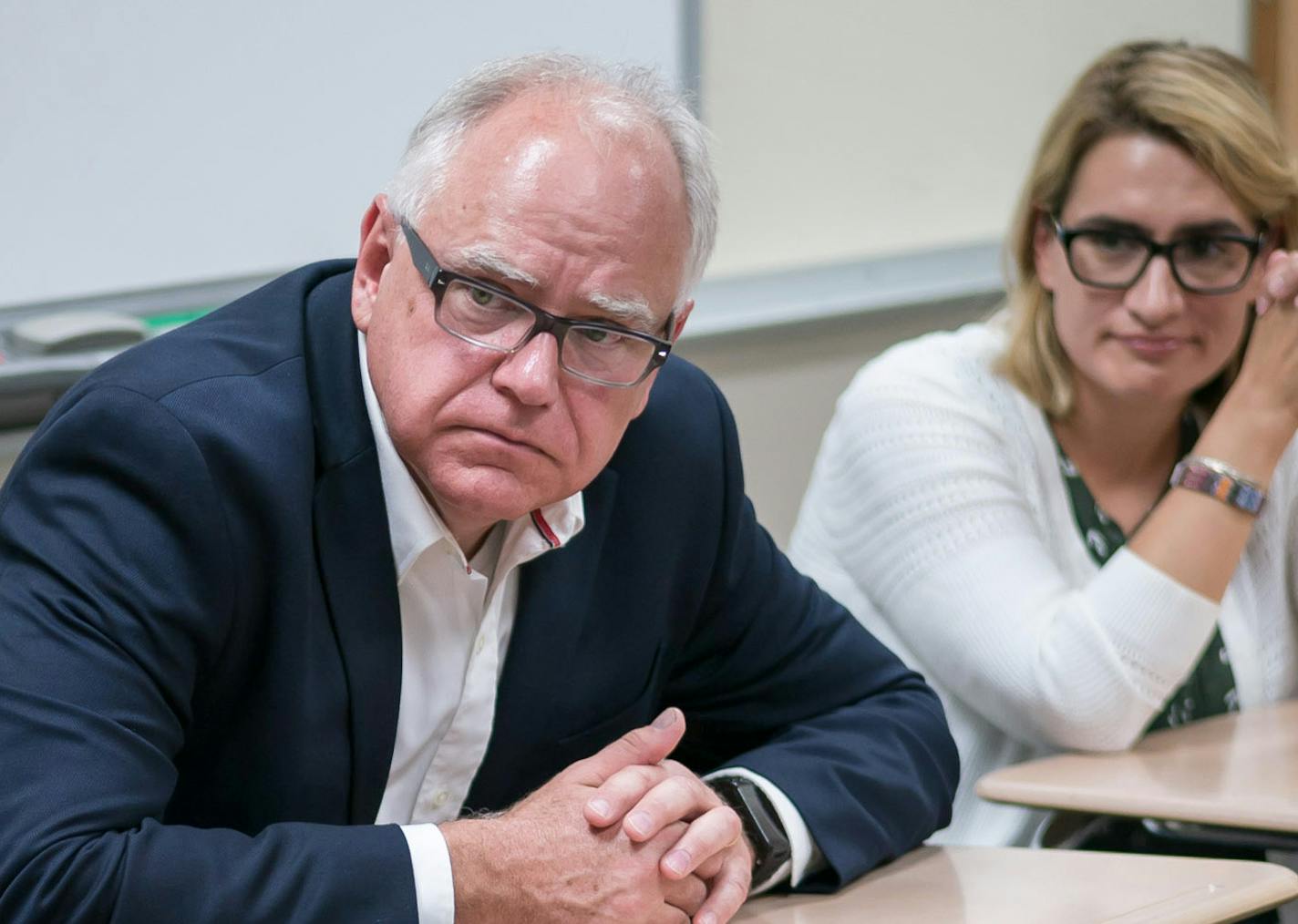 Tim Walz kicked off an education tour with a video interview in his old classroom at West Mankato High School with fellow teachers and former students. On the right is running mate Peggy Flanagan.