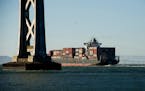 A container ship leaves the San Francisco Bay in San Francisco, California, U.S., on Thursday, June 20, 2013. The U.S. Commerce Department's Bureau of