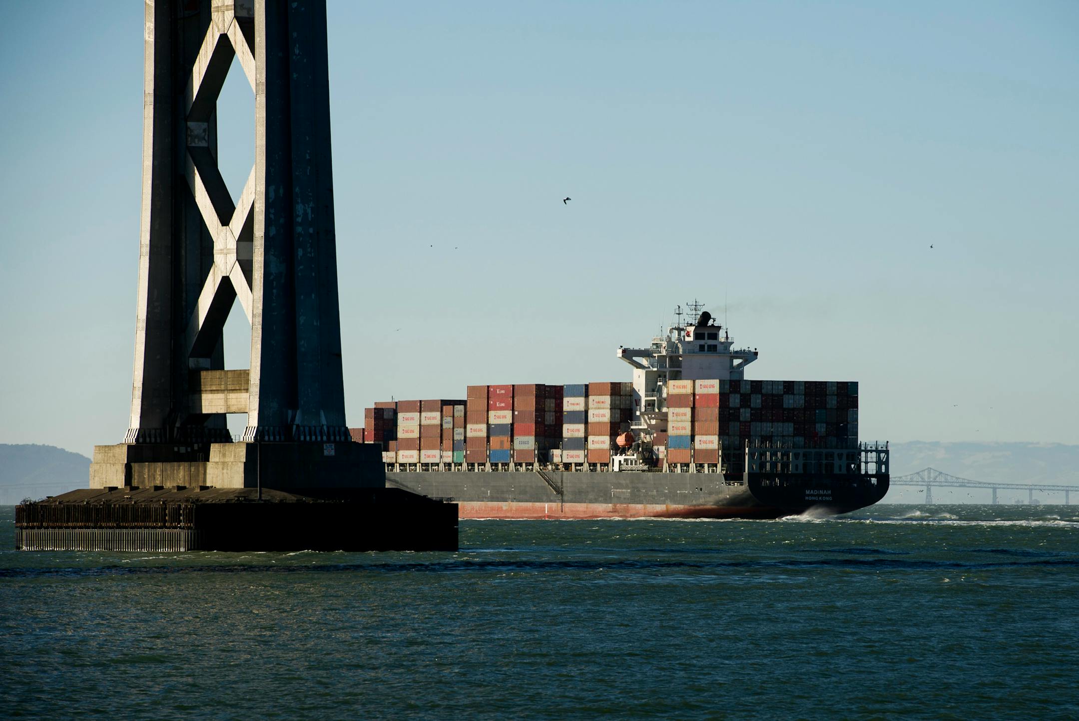 A container ship leaves the San Francisco Bay in San Francisco, California, U.S., on Thursday, June 20, 2013. The U.S. Commerce Department's Bureau of Economic Analysis is scheduled to release gross domestic product (GDP) figures on June 26. Photographer: David Paul Morris/Bloomberg