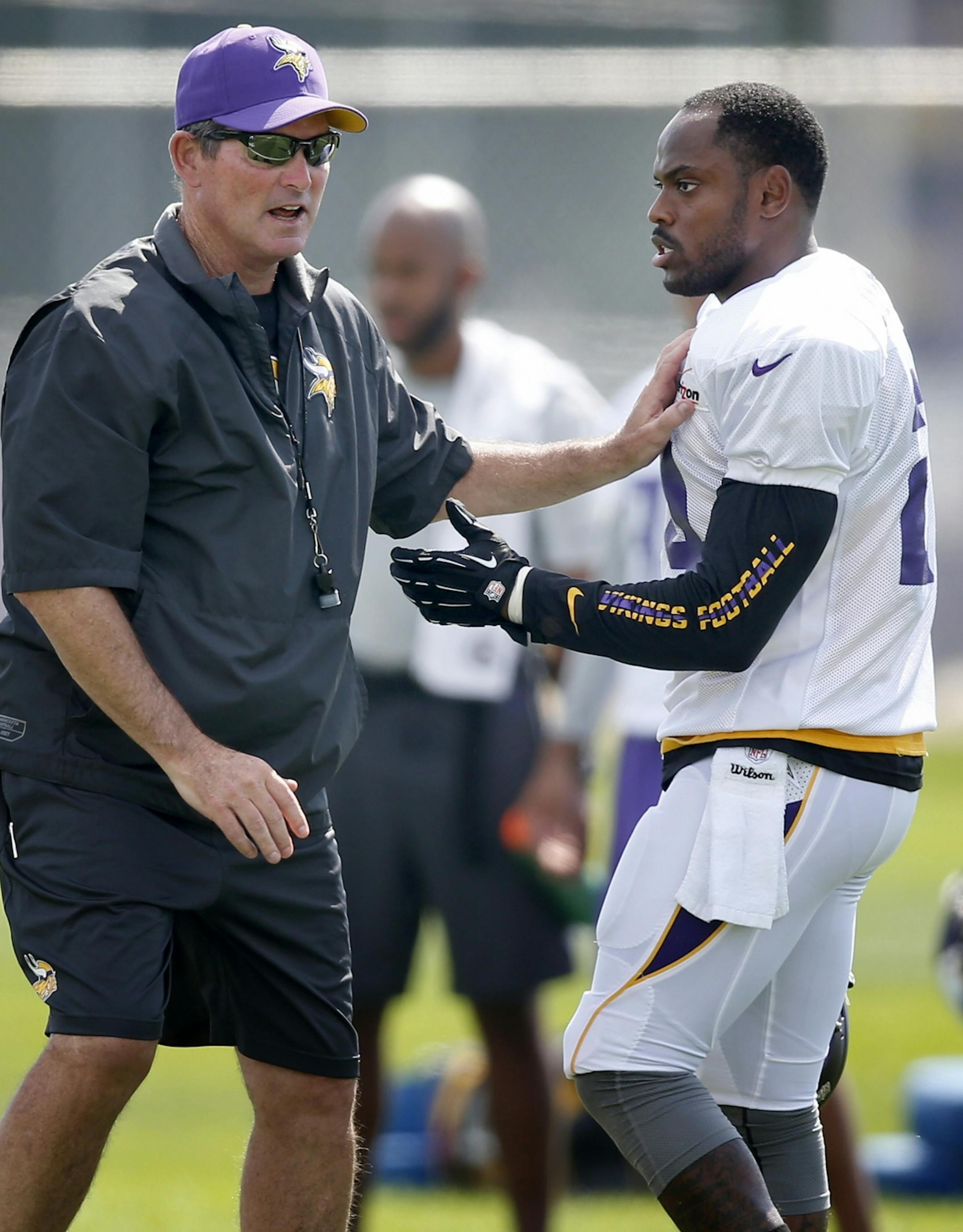 Minnesota Vikings head coach Mike Zimmer worked with Captain Munnerlyn (24) during practice on Wednesday.