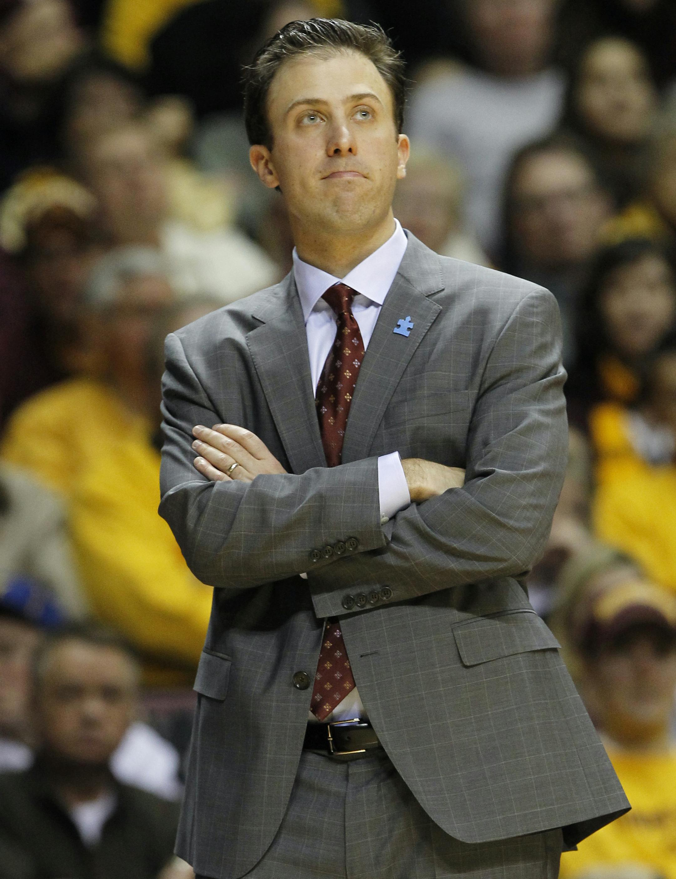 Minnesota head coach Richard Pitino calls out to his players during the second half of an NCAA college basketball game against Northwestern in Minneapolis, Saturday, Feb. 1, 2014. (AP Photo/Ann Heisenfelt)