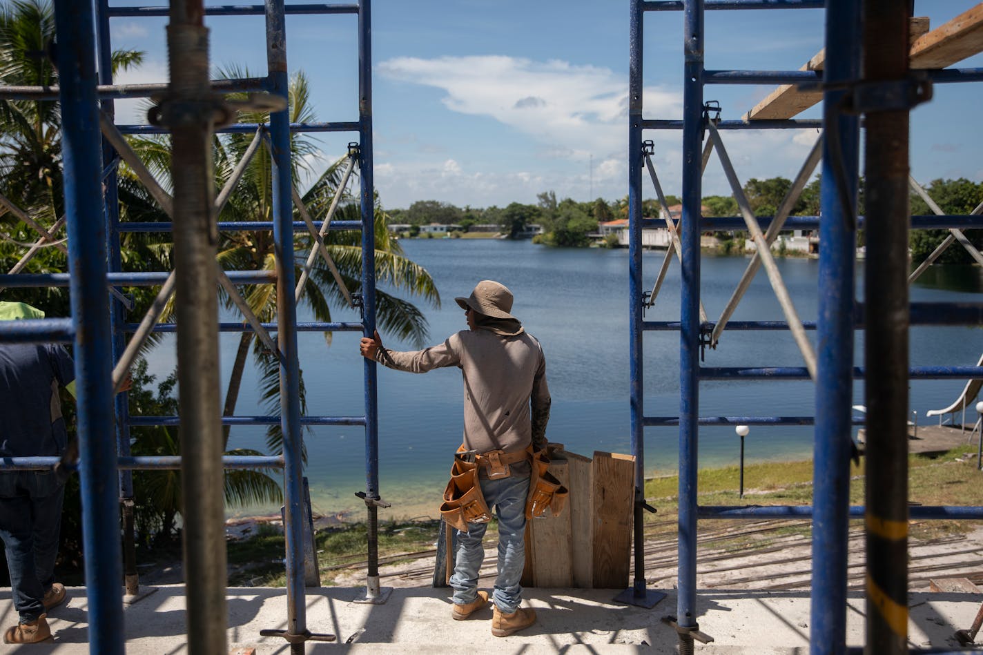 Cristian, a 14 year-old migrant, works on a construction site in North Miami, Fla. instead of going to school, on Aug. 30, 2022. Alone and exploited, migrant children who are arriving to the U.S. in record numbers are ending up in dangerous jobs that violate child labor laws — including in factories that make some of the country's best-known products. (Kirsten Luce/The New York Times)