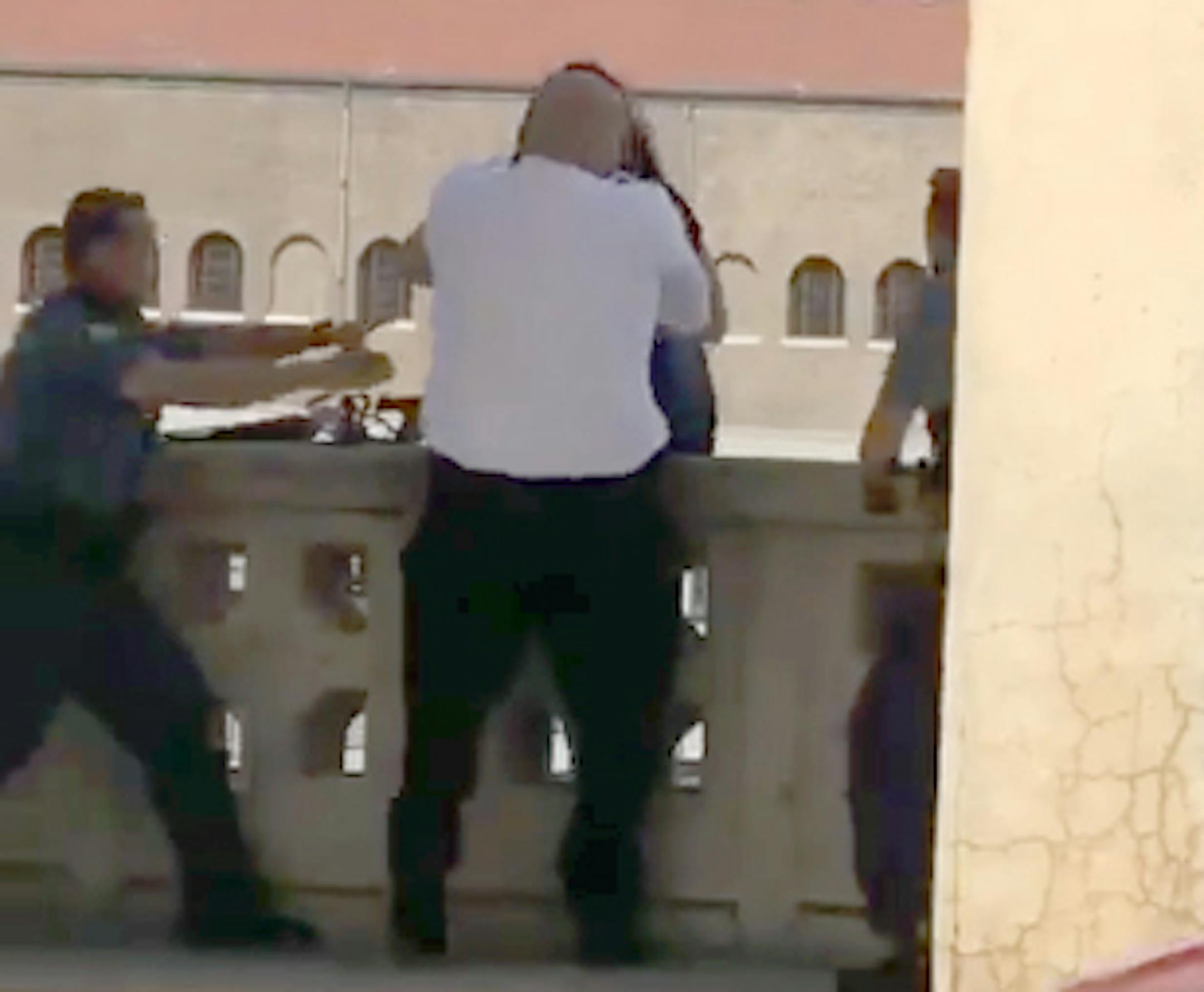This image is from video showing Fire Department District Chief Conrad Ertz plucking a suicidal woman from edge of a Mississippi River bridge in St. Paul. Joining the rescue were officers Shawn Longen, left, and Len Wall.