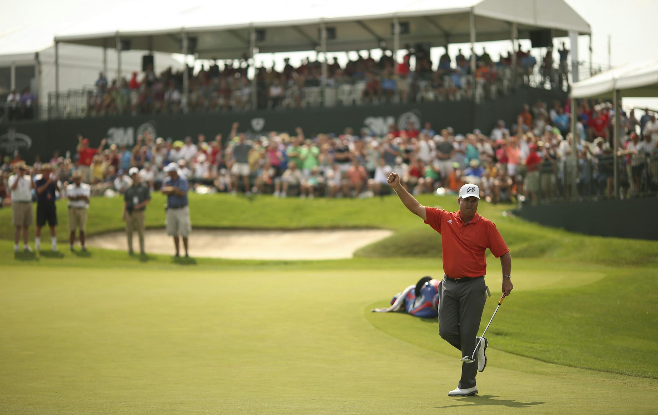 Kenny Perry celebrated after he sunk a 15 foot putt on the 18th hole for a birdie and the tournament win Sunday afternoon at the TPC in Blaine. ] JEFF WHEELER &#xef; jeff.wheeler@startribune.com The 3M Championship concluded on Sunday afternoon with Kenny Perry winning by a stroke over a Bernhard Langer at the Tournament Players Club Twin Cities in Blaine August 3, 2014. ORG XMIT: MIN1408031659381844