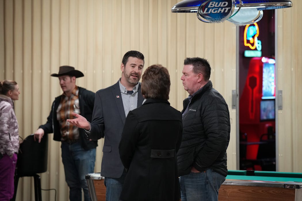 Congressional candidate Steve Boyd, left center, spoke with state Rep. Tom Murphy, R-Underwood, before the Fergus Falls event on Saturday, Jan. 6, 2024. 