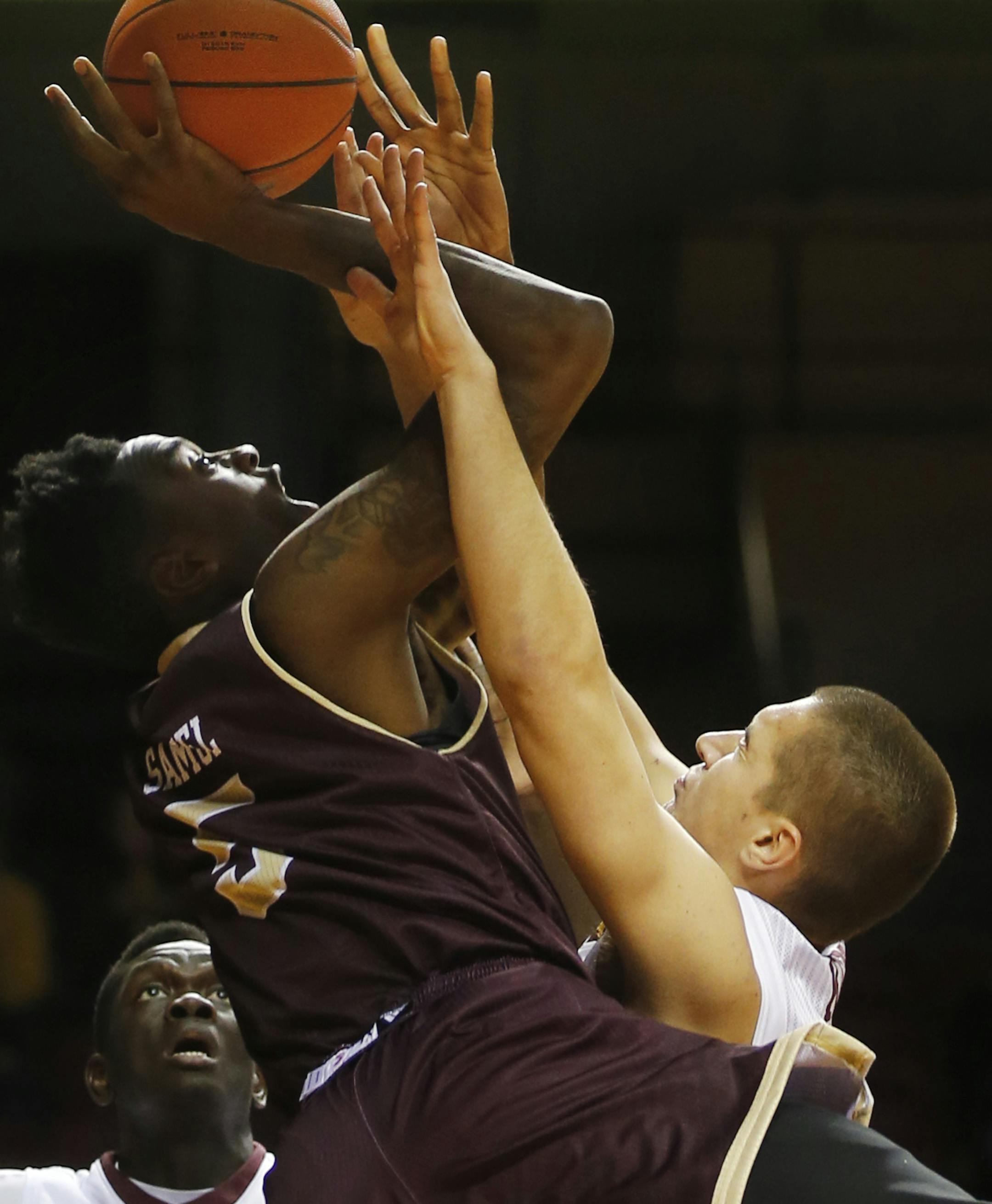 At Williams Aren in a game between University of Louisiana-Monroe and the U of M Gophers, Jamaal Samuel(5) went up for a shot as Joey King(24) blocked it. The final score was 67-56 with the Gophers winning.]Richard Tsong-Taatarii/rtsong-taatarii@startribune.com