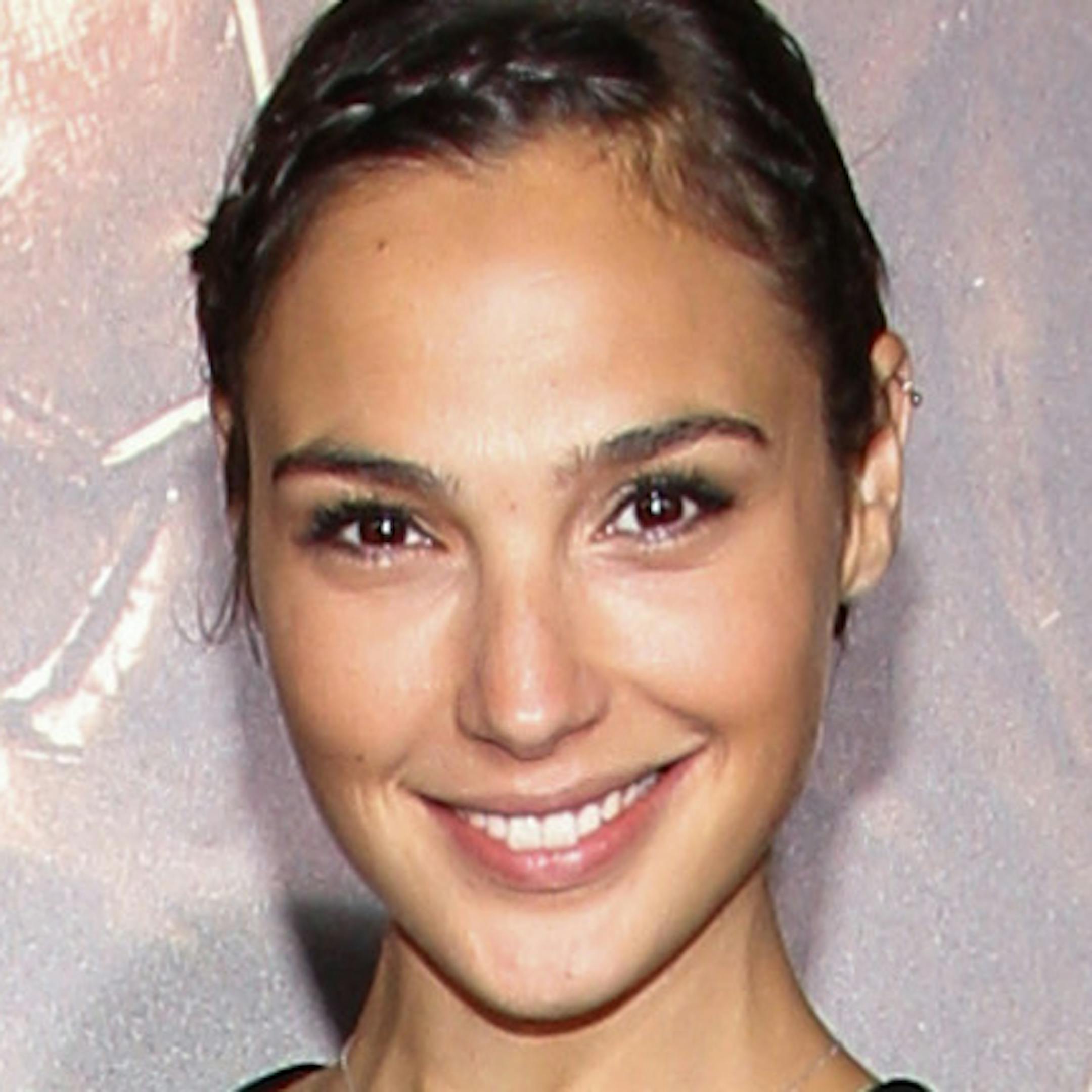 FILE- In this Aug. 28, 2013 file photo, actress Gal Gadot arrives at the world premiere of "Riddick" at the Mann Village Westwood Theater in Los Angeles. Gadot has been cast as Wonder Woman in Warner Bros. superhero team-up film with Batman and Superman. Warner Bros. made the casting announcement Wednesday, Dec. 4, 2013. (Photo by Paul A. Hebert/Invision/AP, File)