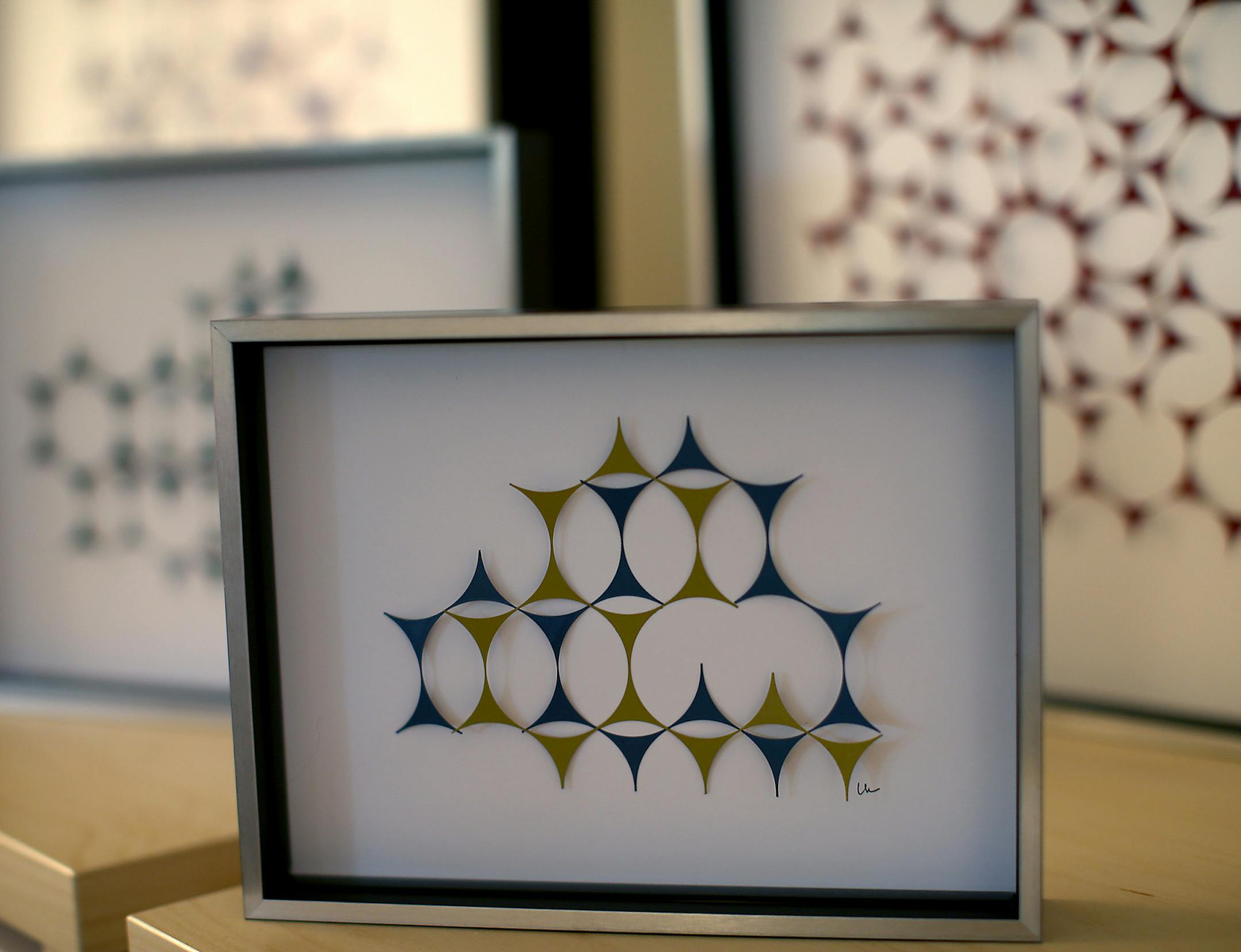 An example of Louise Harris’ “upcycled” art using furnace filters.