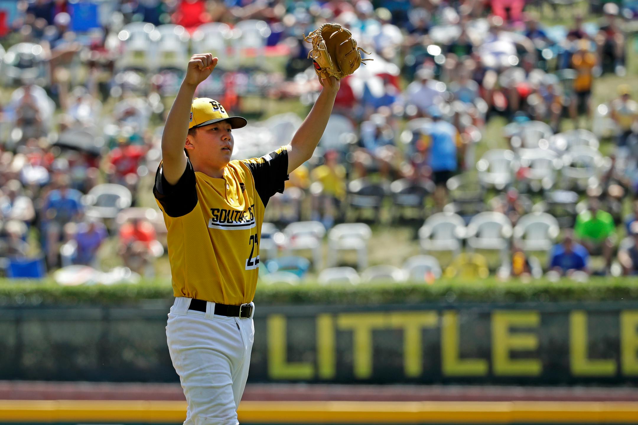 South Riding, Virginia pitcher Justin Lee celebrates getting the final out of the fourth inning and an 11-0 win over Coon Rapids, Minnesota in a baseball game at the Little League World Series tournament in South Williamsport, Pa., Sunday, Aug. 18, 2019. Lee allowed no hits in the contest. (AP Photo/Gene J. Puskar)