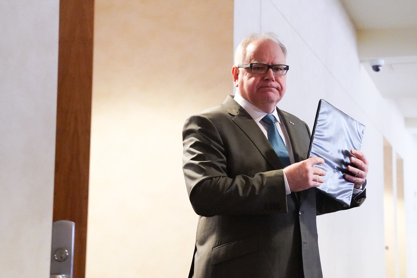 The trade group representing Minnesota&#x2019;s nonprofit health insurers says 2019 results show financial stability with the likely onset of COVID-19 medical bills. Gov. Tim Walz, shown here in March, has announced an agreement with the nonprofit health plans that will waive out-of-pocket treatment costs for some COVID-19 patients. (Photo by GLEN STUBBE/ glen.stubbe@startribune.com) ORG XMIT: MIN2003181556411282