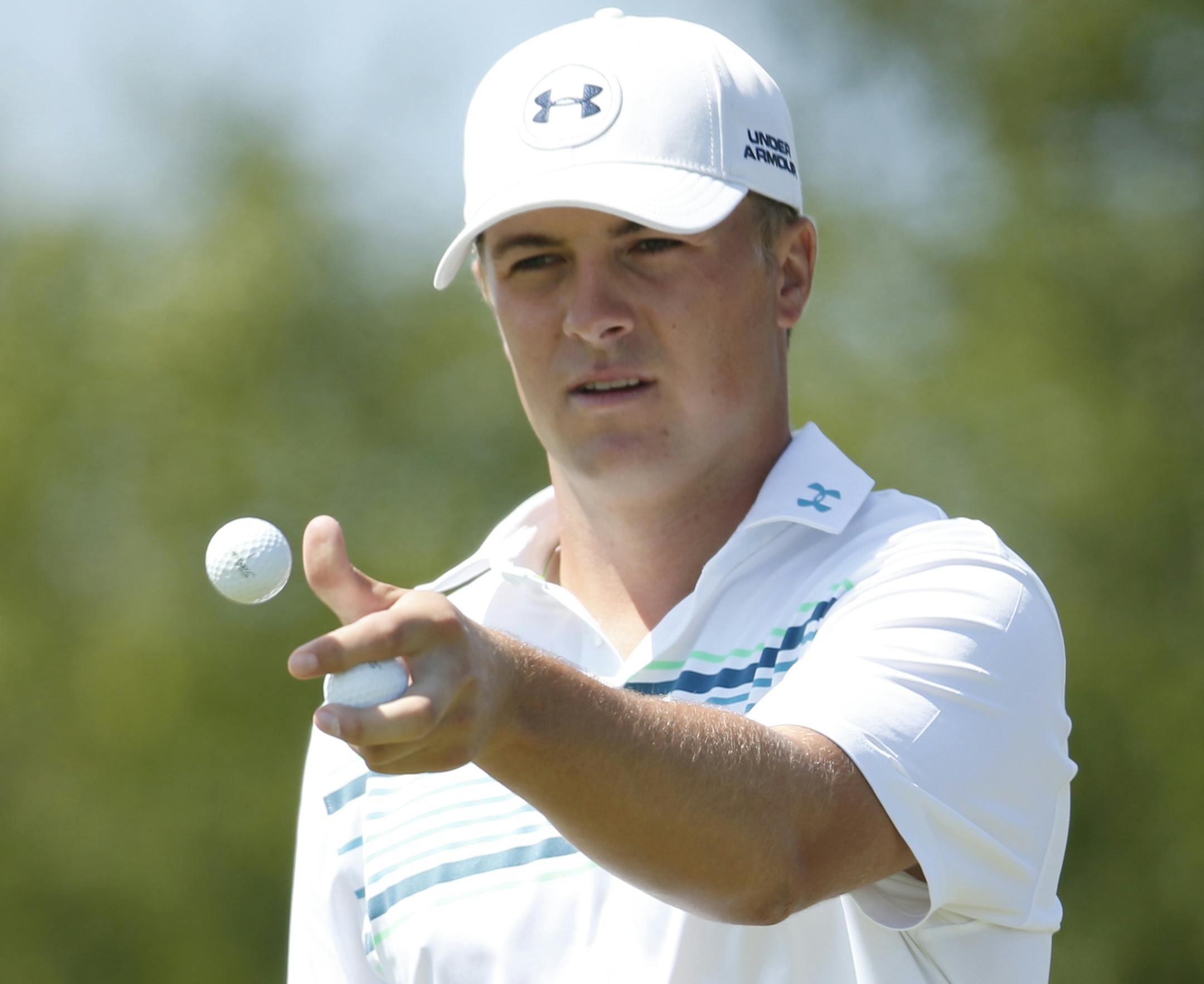 Jordan Spieth catches a ball on the fifth hole during a practice round for the PGA Championship golf tournament Wednesday, Aug. 12, 2015, at Whistling Straits in Haven, Wis. (AP Photo/Julio Cortez)