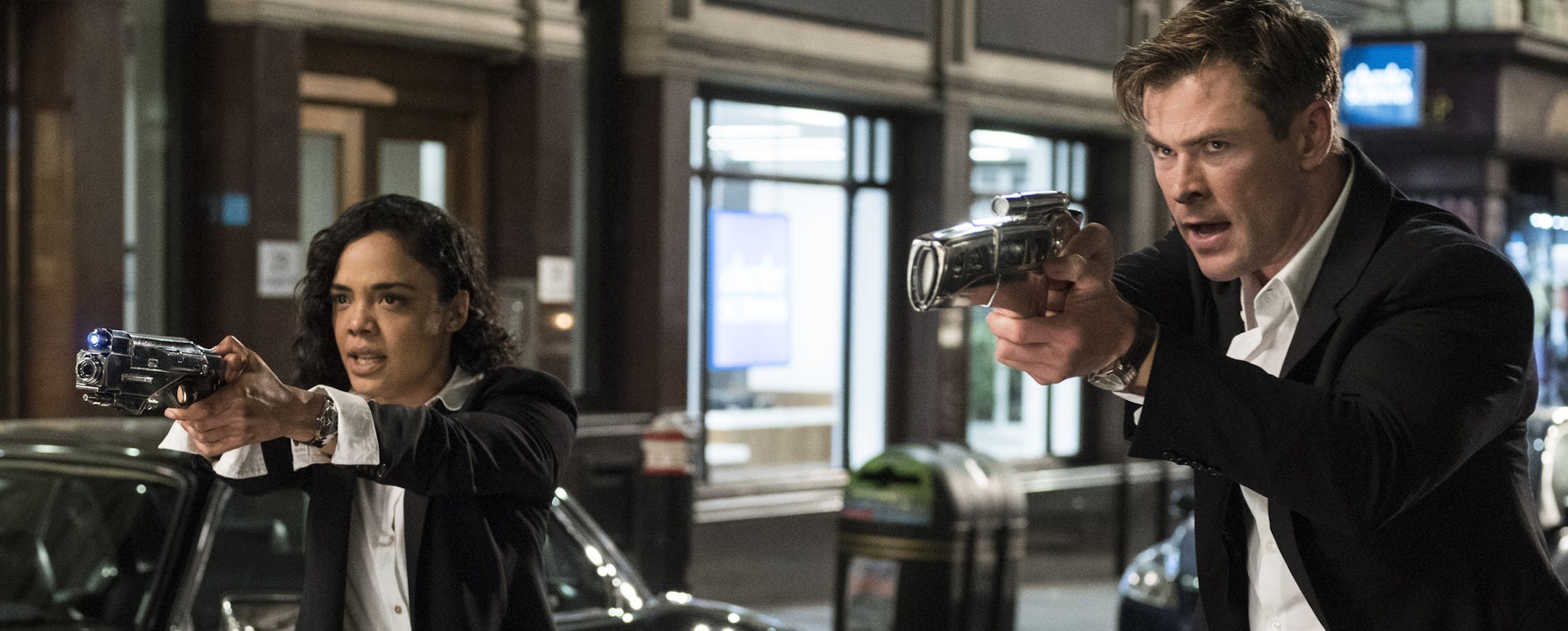 This image released by Sony Pictures shows Tessa Thompson and Chris Hemsworth in a scene from Columbia Pictures' "Men in Black: International." (Giles Keyte/Sony/Columbia Pictures via AP)