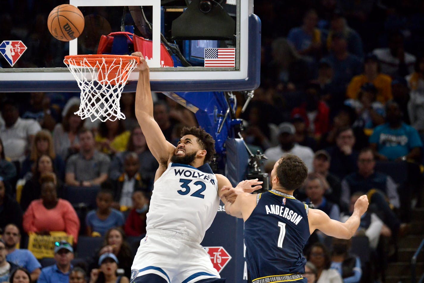 Timberwolves center Karl-Anthony Towns is fouled as he shoots against Grizzlies forward Kyle Andersonin the first half