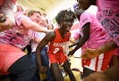 Agwa Nywesh celebrated in the student section after making a last-second basket to win Monday night's game against Mayo. He scored 30 points while wea