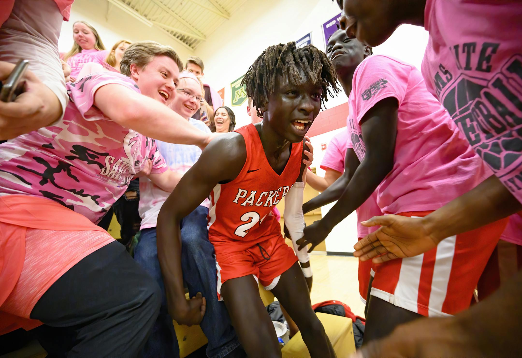 Agwa Nywesh celebrated in the student section after making a last-second basket to win Monday night's game against Mayo. He scored 30 points while wearing Kobe Bryant's No. 24, the day after Bryant was killed with his daughter and seven others in a helicopter crash. ] Aaron Lavinsky • aaron.lavinsky@startribune.com Photos to accompany a feature on the ethnic diversification of Austin Minn., as seen through the Austin High School boys basketball and soccer programs, photographed Monday, Ja