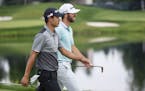 Matthew Wolff and Collin Morikawa talk and share a laugh as they walk down the 17th fairway tied for the lead at -19. ALEX KORMANN ¥ alex.kormann@sta