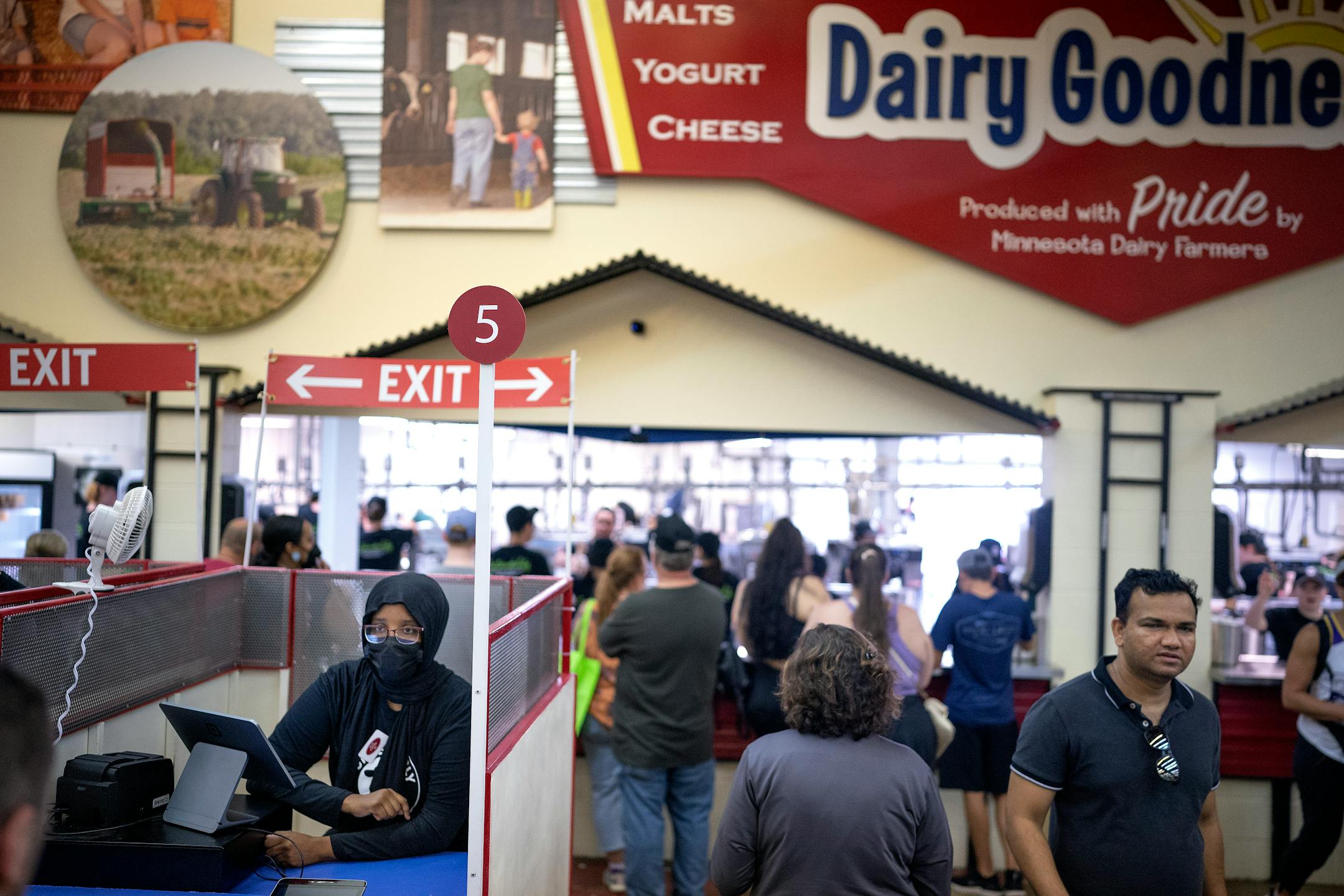 Fahma Ahmed, a 16-year-old high school student, worked as a casher Sunday in the Dairy Building at the Minnesota State Fair.