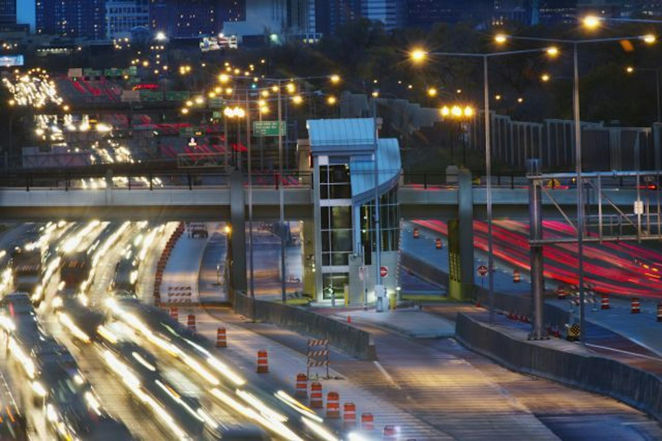 Looking toward downtown Minneapolis from the 50th Street overpass. Rush hour traffic strattles the new MTC 46th Street Bus Station soon to open.