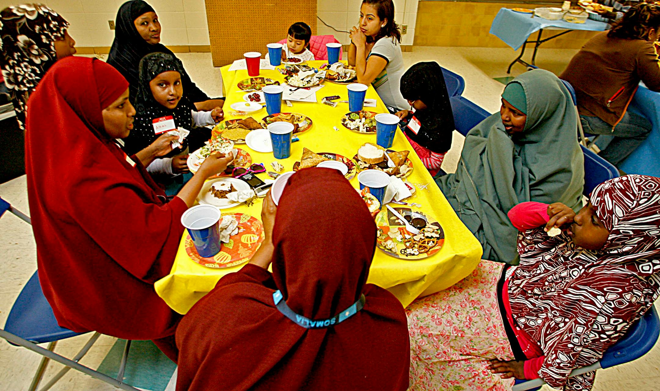 A group of families and students of Somali descent sat together for the dinner.