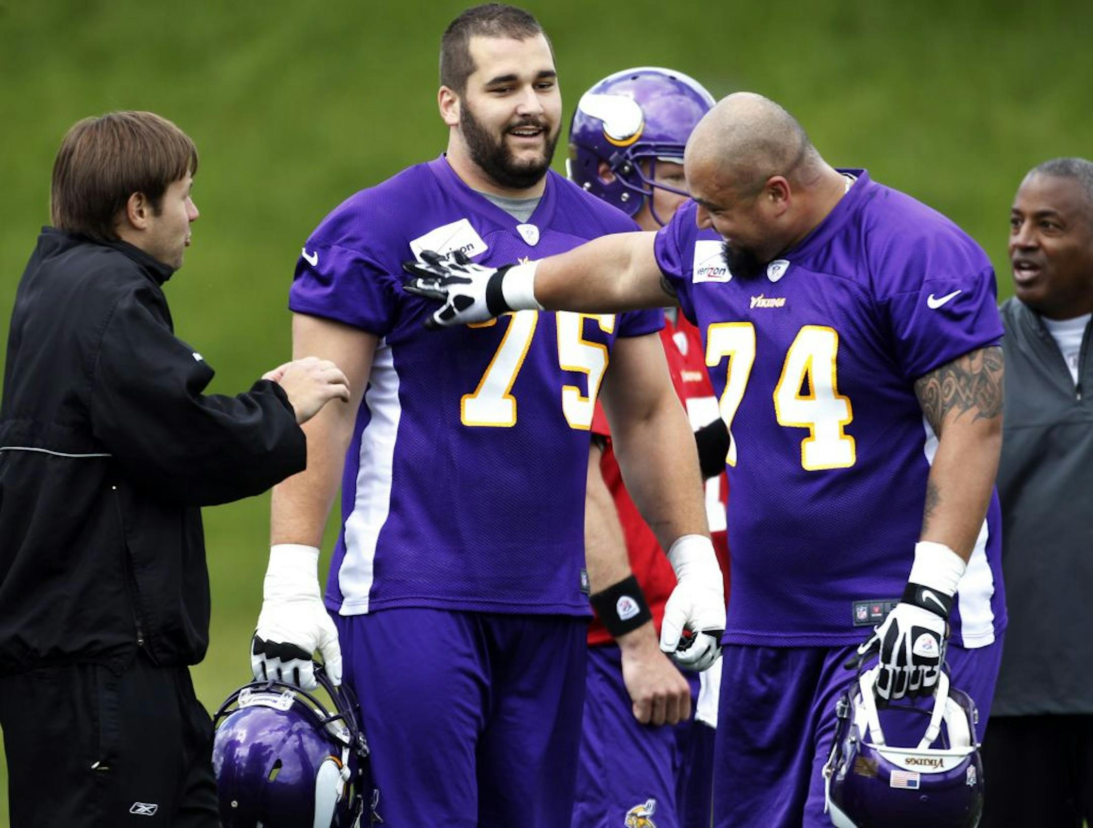 Vikings linemen Charlie Johnson right and Matt Kalil relaxed between plays during Vikings organized team activities Wednesday May 30, 2012 at Winter Park in Eden Prairie, MN.