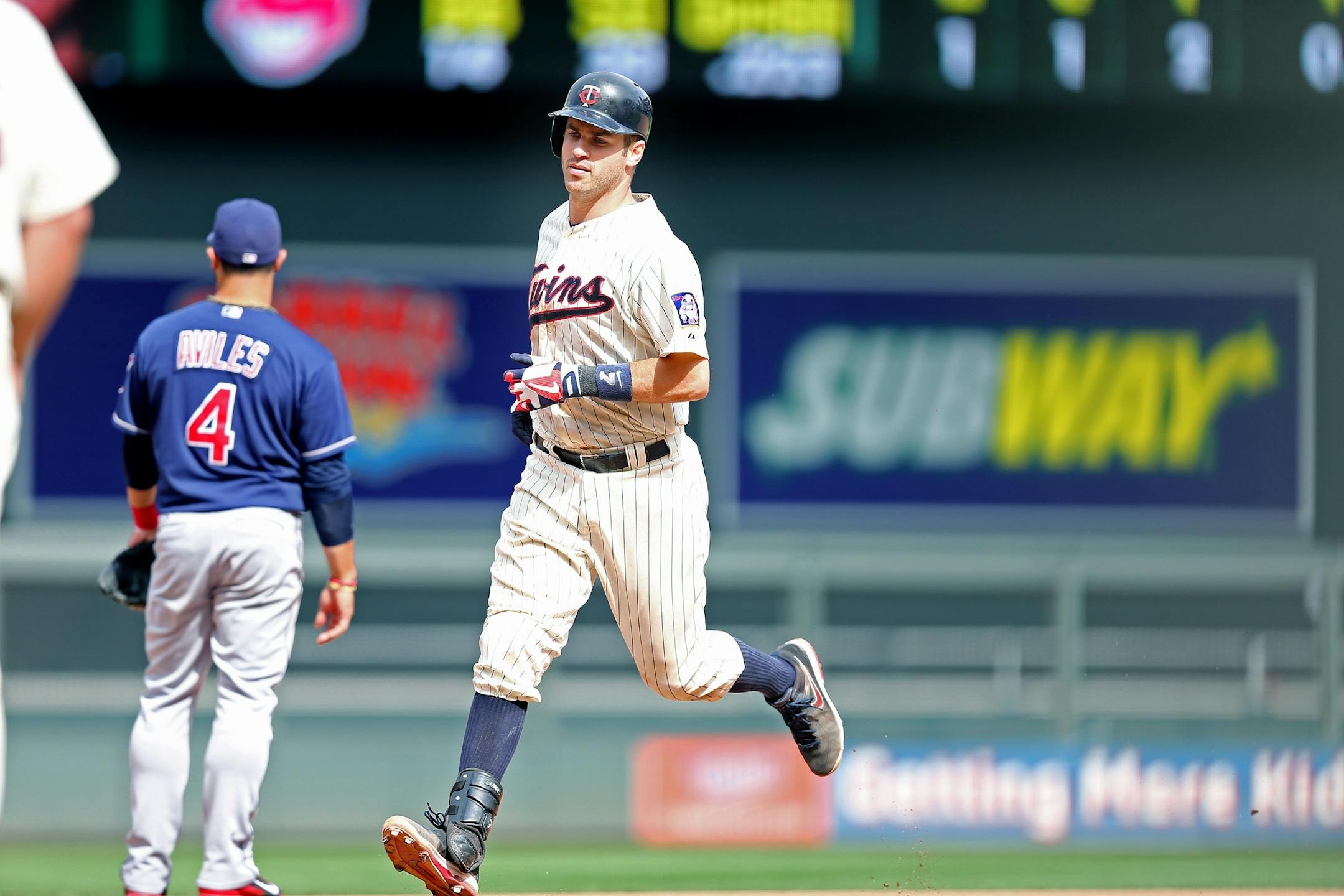 Joe Mauer rounded second after hitting a solo home run in the 10th inning Wednesday.