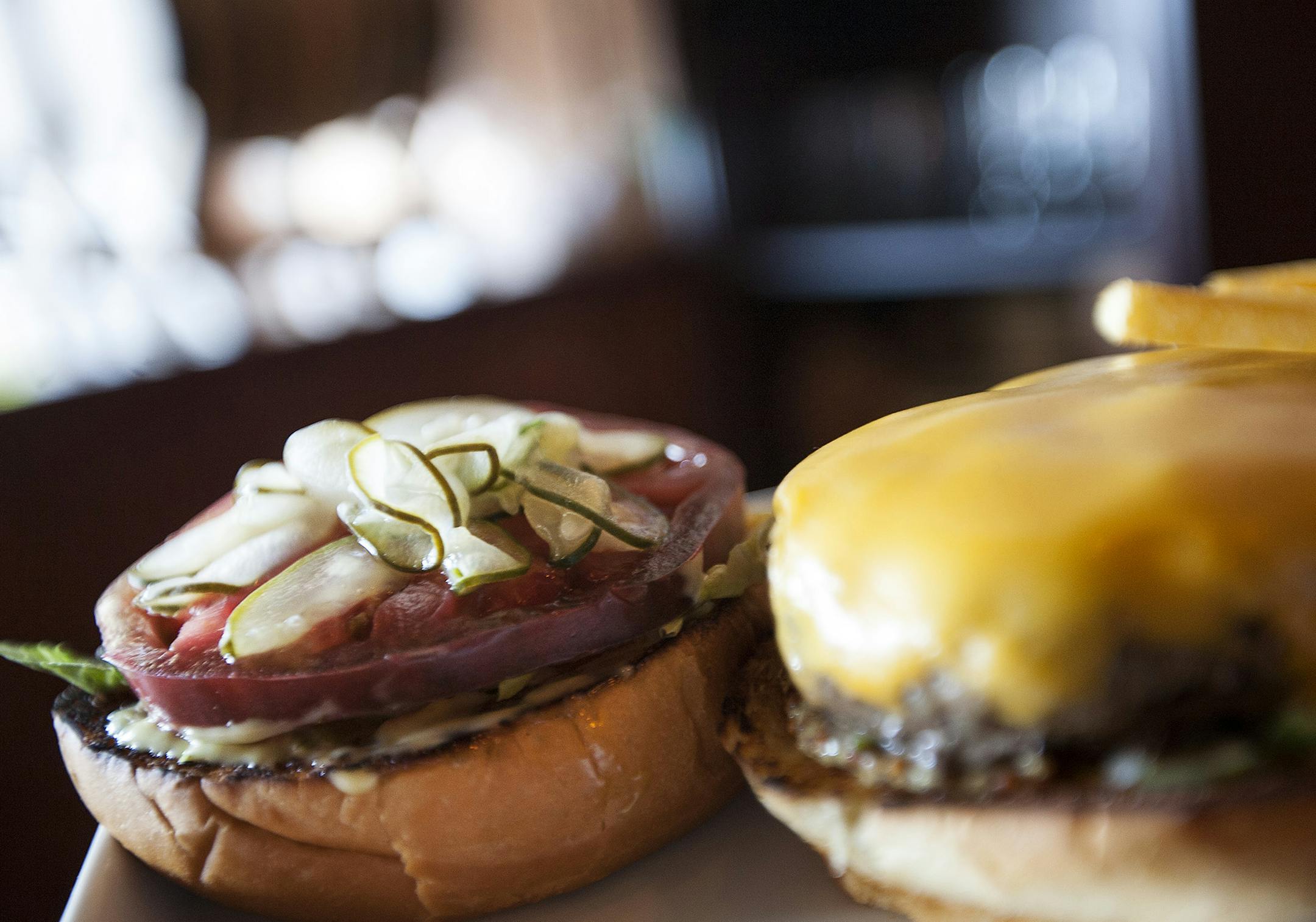 The LYN65 burger is a house cured burger with pickles two ways, American cheese and house cut fries at LYN65 in Richfield September 6, 2014. (Courtney Perry/Special to the Star Tribune)