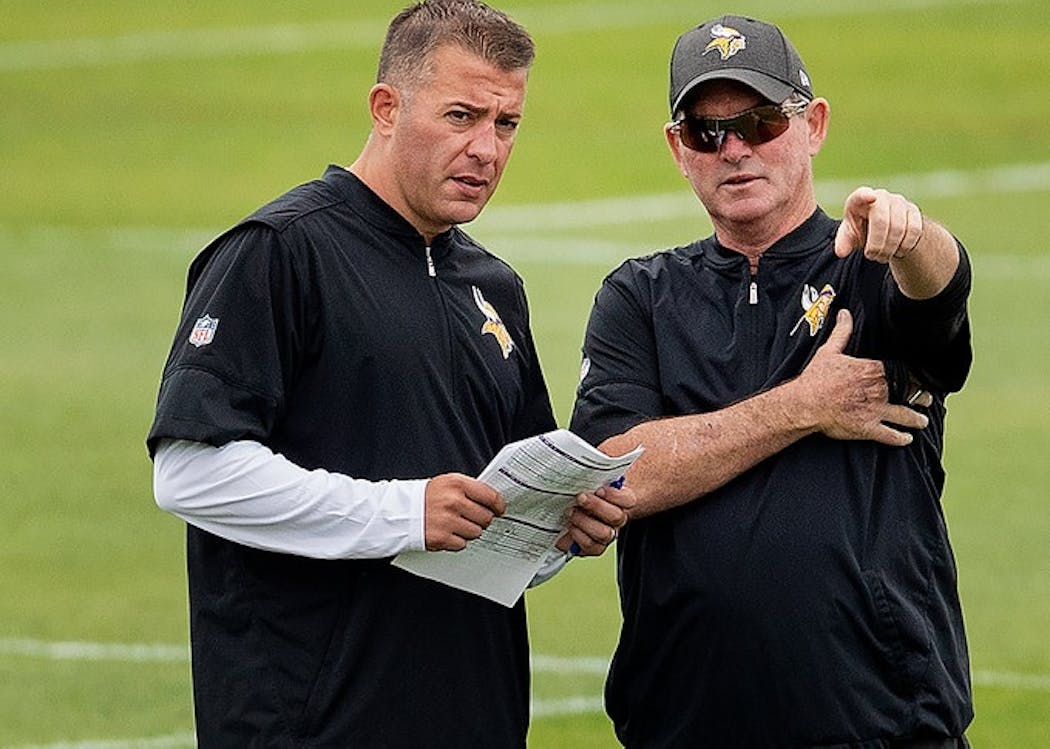 Mike Zimmer and John DeFilippo during the 2018 season before their break-up.