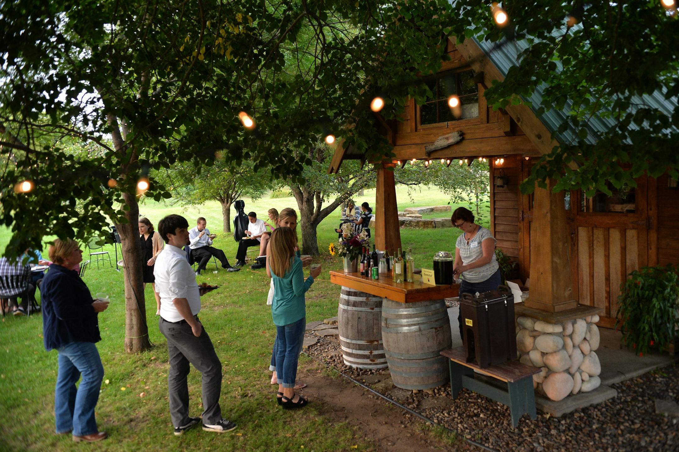 Guests indulge in all-you-can-drink wine at Wine & Dine for Climate at Alexis Bailly Vineyard in Hastings.