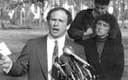 Minnesota's US Senator-elect Paul Wellstone (left), with wife Sheila (right), holds a news conference in front of the Vietnam Veteran's Memorial in Wa