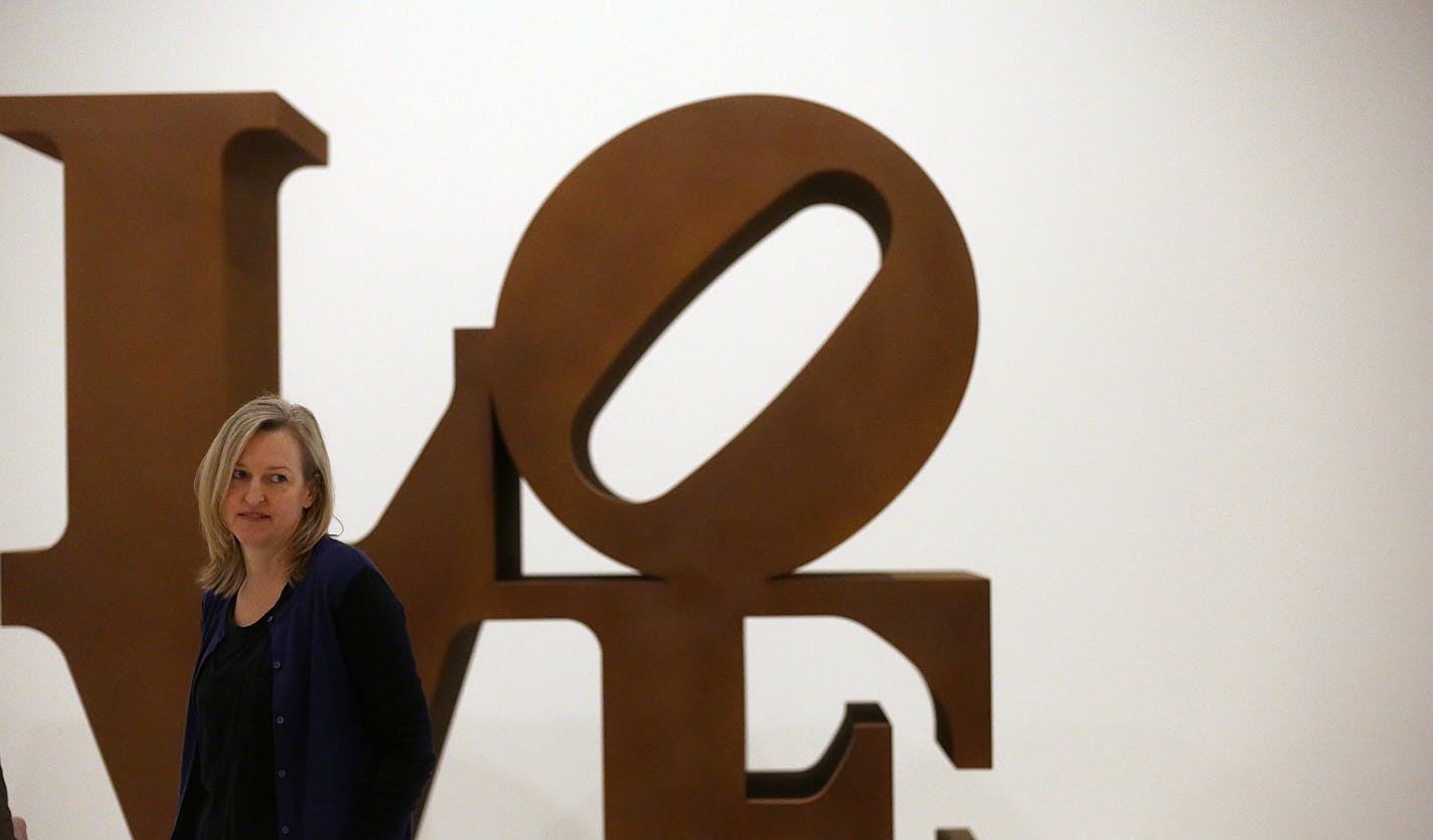 Curator Siri Engberg stood near Robert Indiana&#x201a;&#xc4;&#xf4;s, LOVE (1966-1998, Cor-Ten steel; ed. 2/5) and the figure of a worker at the Walker were reflected (upper left) in the artwork of Michelangelo Pistoletto&#x201a;&#xc4;&#xf4;s, Uomo Alla Balconata (Man on a Balcony) (1965, oil, graphite on paper mounted to stainless steel). ] JIM GEHRZ &#x201a;&#xc4;&#xa2; jgehrz@startribune.com / Brooklyn Center, MN / January 29 , 2015 / 10:00 AM / BACKGROUND INFORMATION: In celebration of its 75