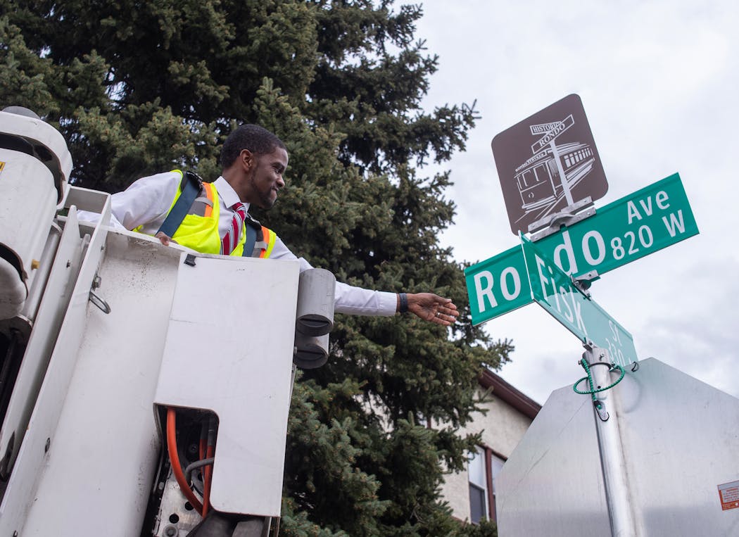 Mayor Melvin Carter helps unveil the renaming of the frontage road as Rondo Avenue in St. Paul on Tuesday.