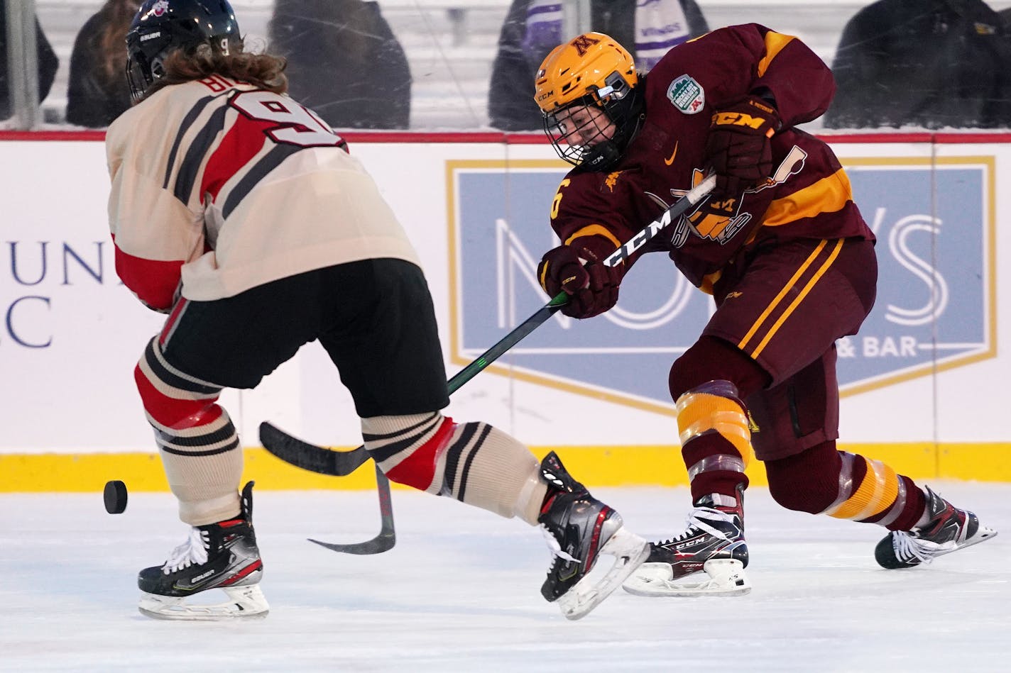 Gophers forward Amy Potomak took a shot as Ohio State defenseman Madison Bizal tried to block it during Minnesota's 2-1 victory in an outdoors game at Parade Stadium on Jan. 18. The Gophers will play host to the Buckeyes in the NCAA women's hockey tournament Saturday.