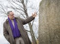 Runologist/scholar Henrik Williams with a Viking Age runestone in Sweden. [
Photo credit: Michael Wallerstedt Henrik Williams Professor i nordiska spr