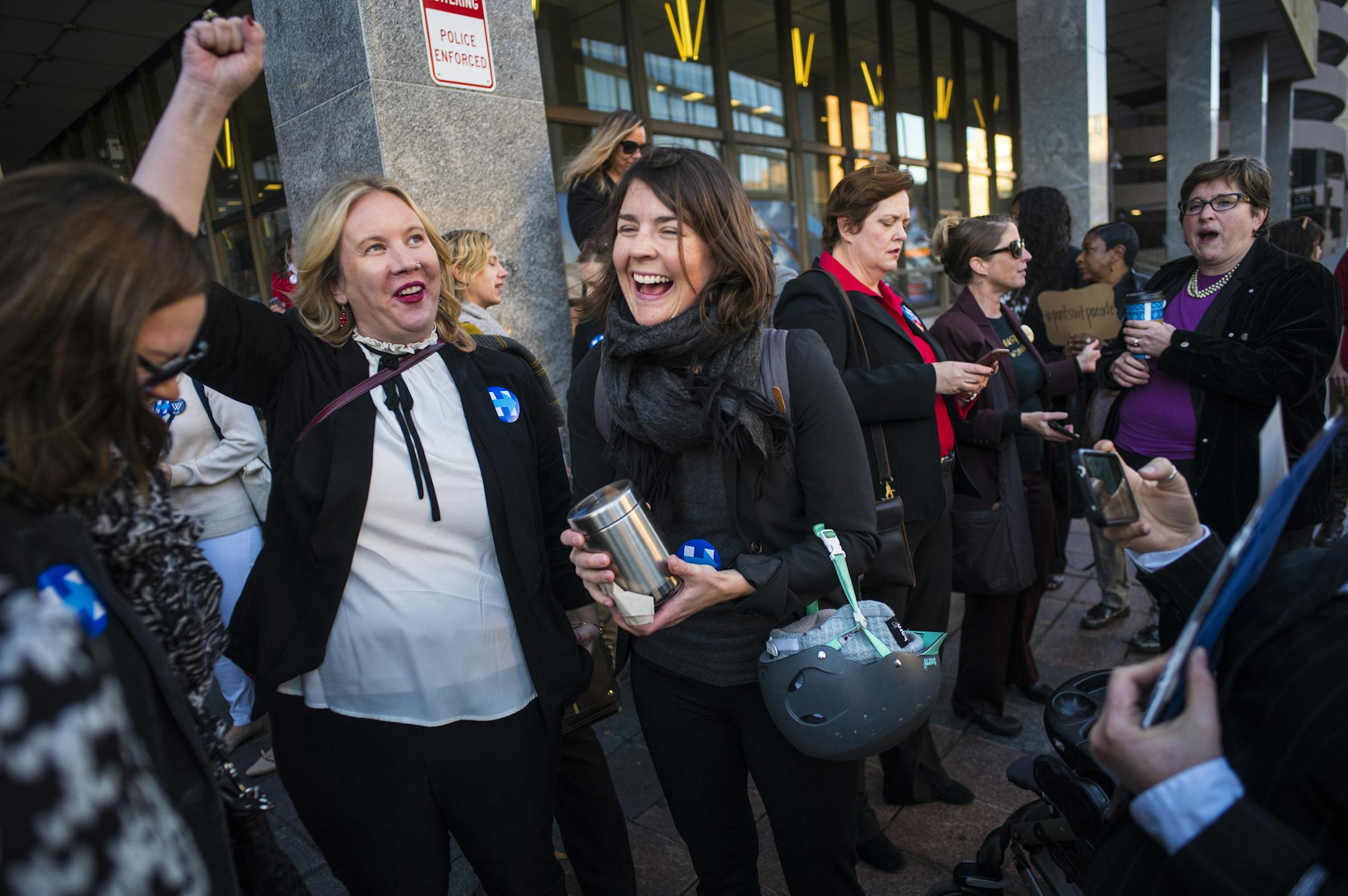 Over fifty Hillary Clinton supporters wear pantsuits in a parade around downtown Minneapolis to express their voting power.]Richard Tsong-Taatarii/rtsong-taatarii@startribune.com