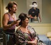 In this image released by Columbia Pictures, onetime counter-terrorist and now-hairstylist Zohan, played by Adam Sandler, left, practices his techniqu