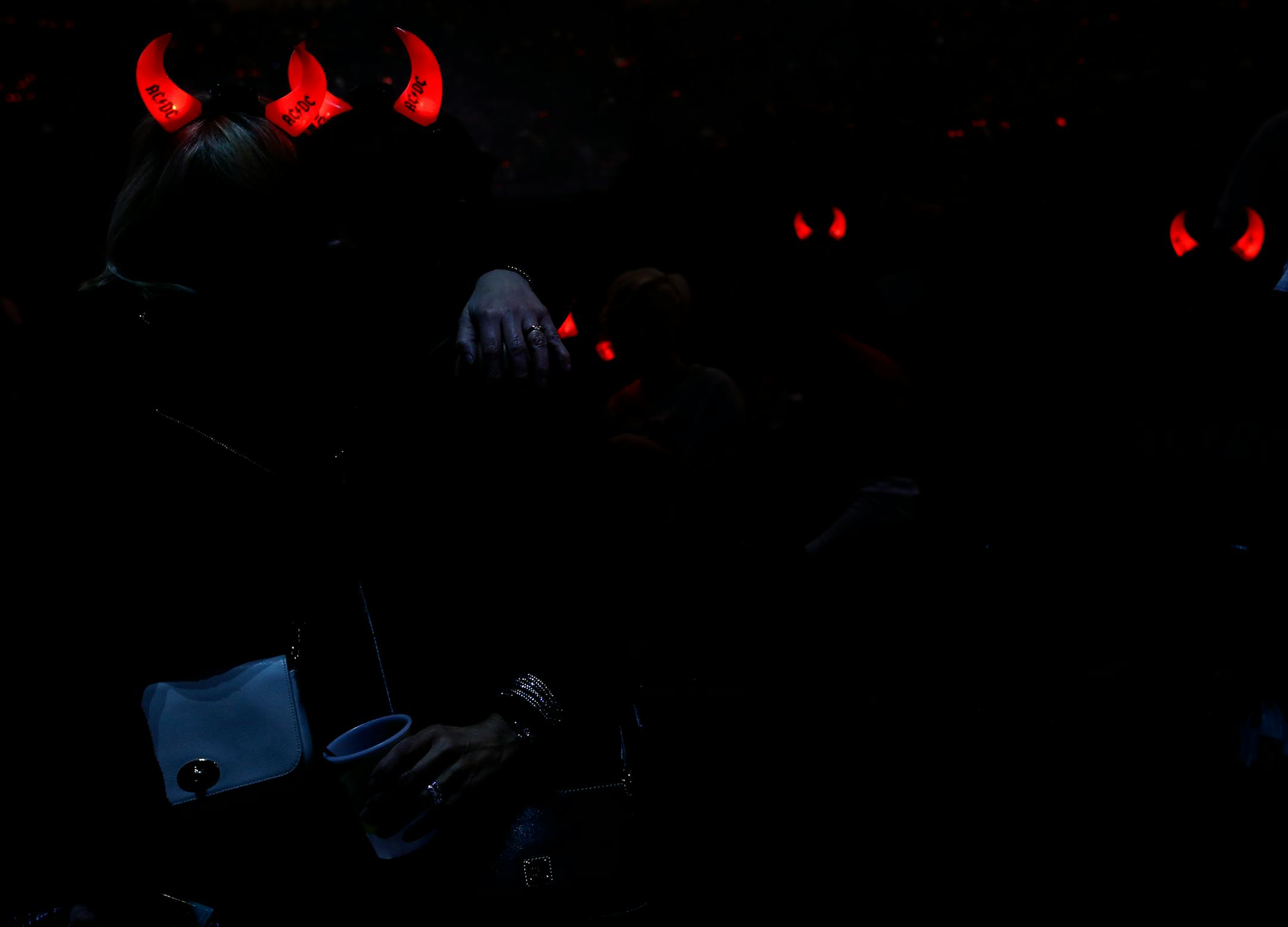 Fans wearing AC/DC horns posed for a photo before the concert at the Xcel Energy Center on Sunday night. ] CARLOS GONZALEZ cgonzalez@startribune.com - February 14, 2016, New St. Paul, MN, Xcel Energy Center, AC/DC Concert
