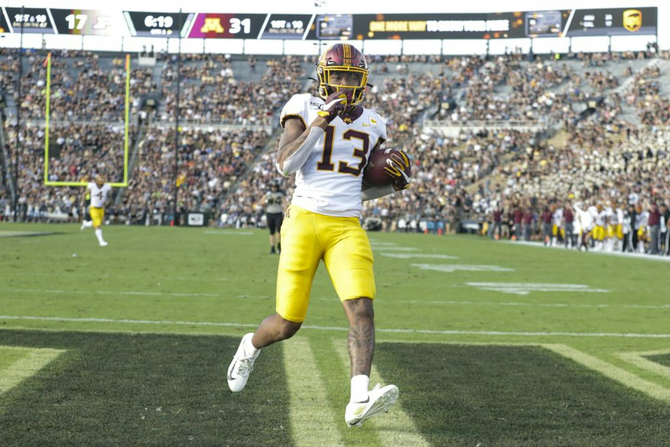 Minnesota wide receiver Rashod Bateman (13) run in for a touchdown after a catch against Purdue during the second half of an NCAA college football game in West Lafayette, Ind., Saturday, Sept. 28, 2019. Minnesota defeated Purdue 38-31.