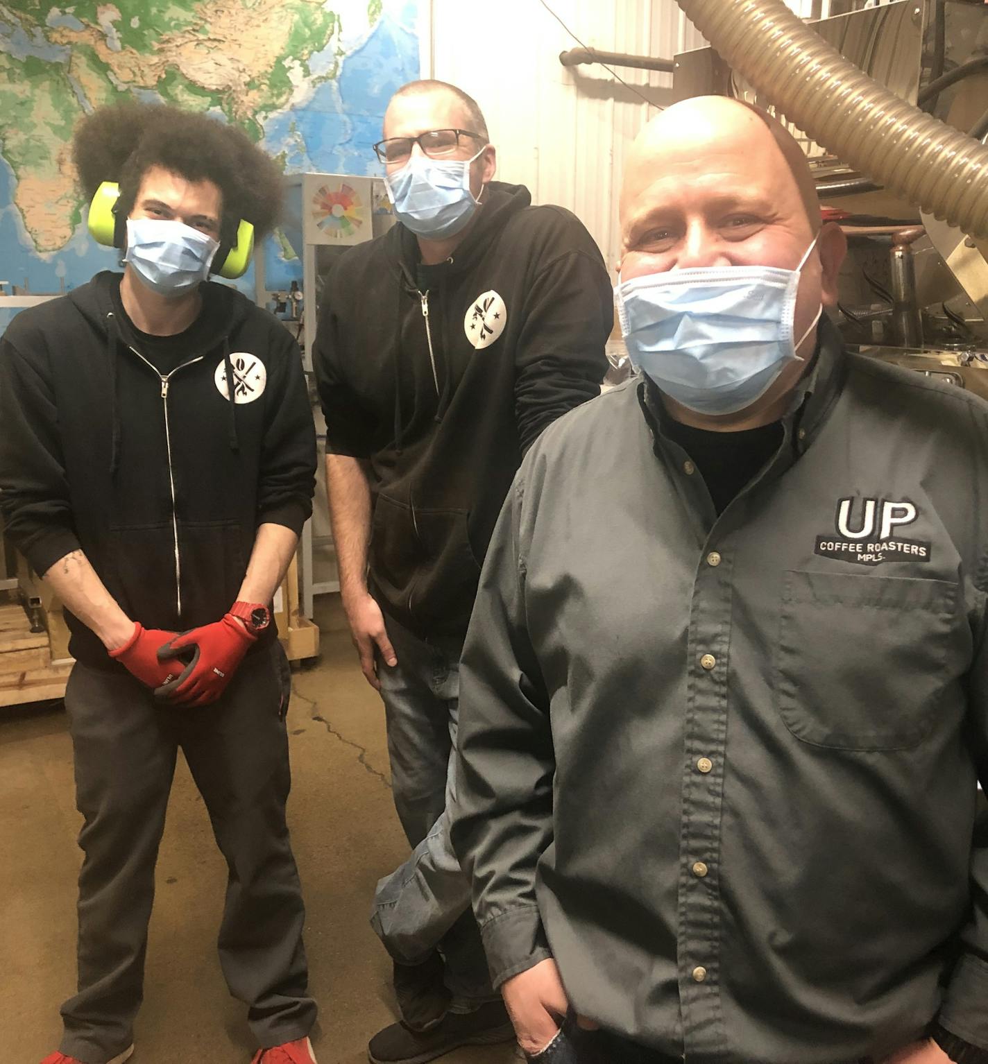 Twenty six-year owner David Chall (foreground) of UP Coffee Roasters, a wholesaler of organic, fair trade coffee food and supplies, to more than 1,000 restaurants, coffee shops, hotels and universities, with veteran roasters C.J. Porter Born (left) and Jesse Grote with UP's five-year-old, $140,000 Loring "smart roaster."
Photo: Neal.St.Anthony@startribune.com