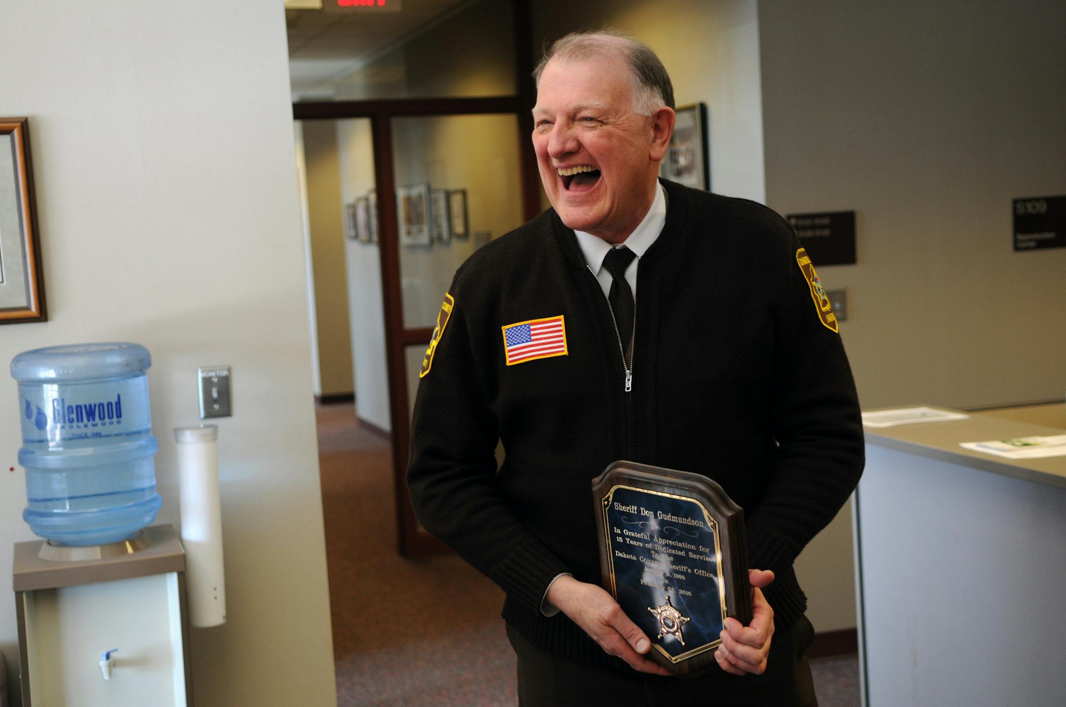 Richard Sennott•rsennott@startribune.com] Hastings Mn. Friday 02/26/2010 Don Gudmundson has been in law enforcement for 40 years, and he's the only sheriff to ever serve in two Minnesota Counties. He got his start in Detroit, and went on to investigate mob crime in Chicago. He was serving his second term as Fillmore County sheriff when hired as Lakeville Police chief, and later, he became Dakota County sheriff. IN THIS PHOTO: ] Don Gudmundson laughs hard while taking some ribbing during a