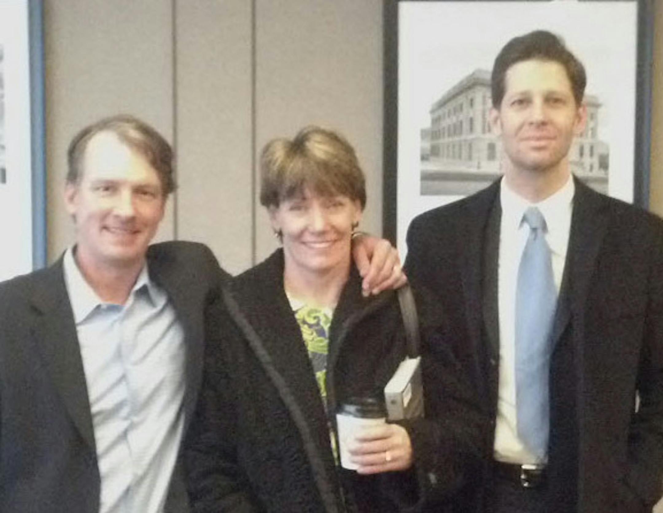 Jean Kidd, center, with Minneapolis Fire Capt. Jean Kidd, center, attorneys John Klassen, left, and Andrew Muller.