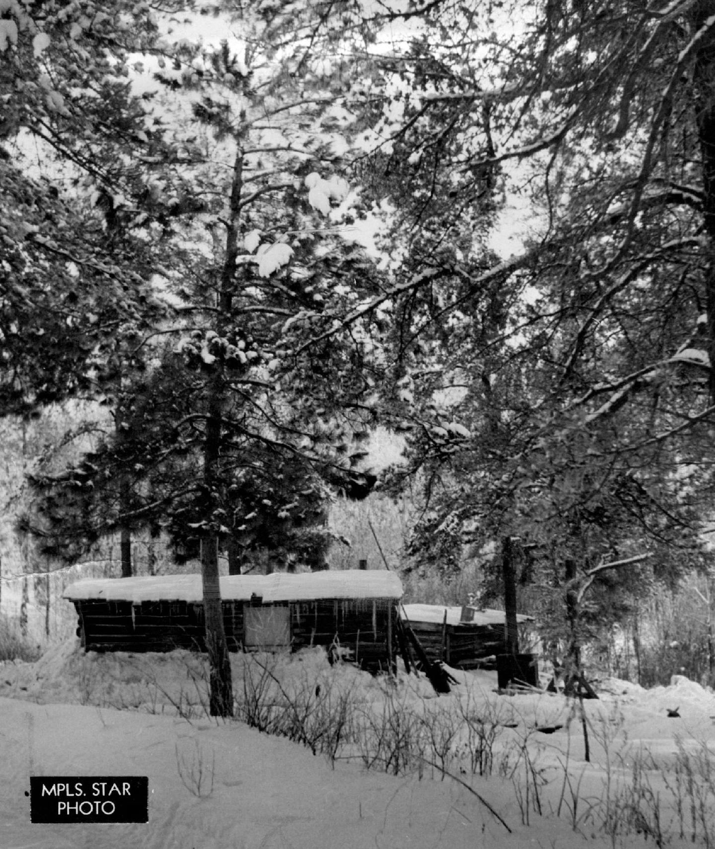 January 24, 1938 Seadlund and Gray lived in this shack a dozen miles north of Emily, Minn., while they kept Charles S. Ross locked in a nearby dugout early last October. It was from this hideout that Seadlund arranged payment of a $ 50,000 ransom. A picture was taken of Ross seated near a birch tree and holding a Chicago paper for Oct ***** Minneapolis Star Tribune