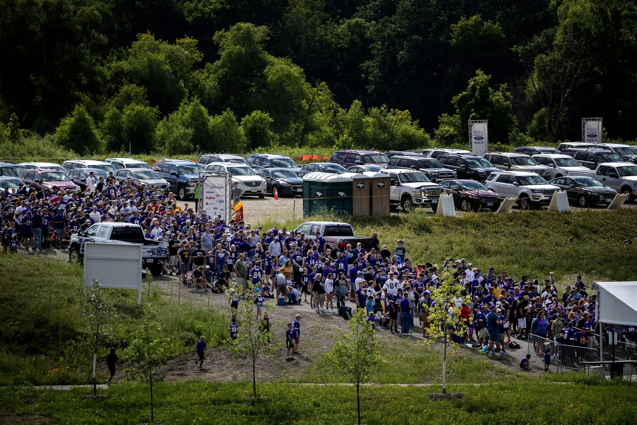 Fans lined up at the gate to enter Minnesota Vikings training camp at TCO Performance Center.