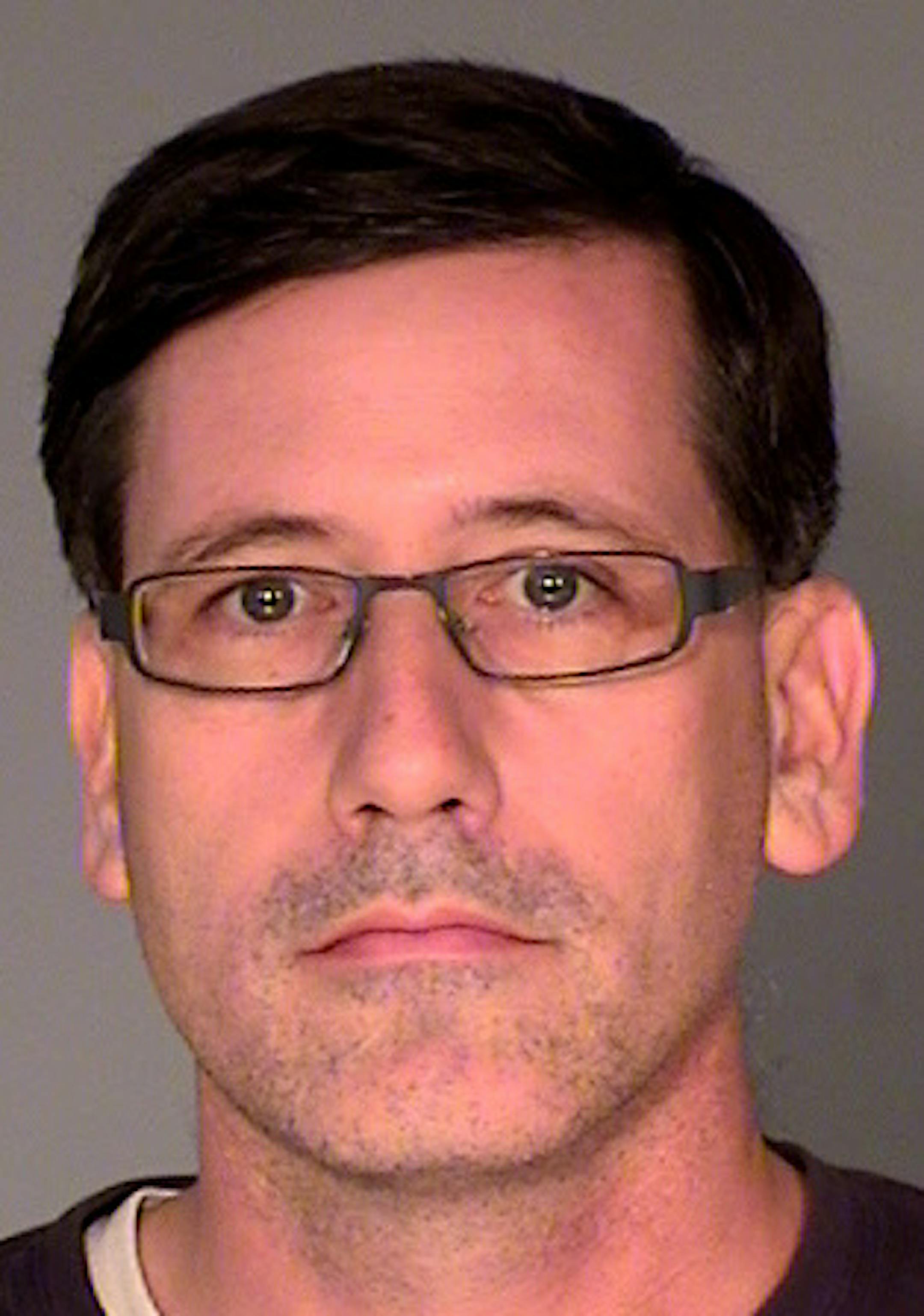 Michael J. Mangan, charged with aggravated stalking and terroristic threats for allegedly threatening to harm others.