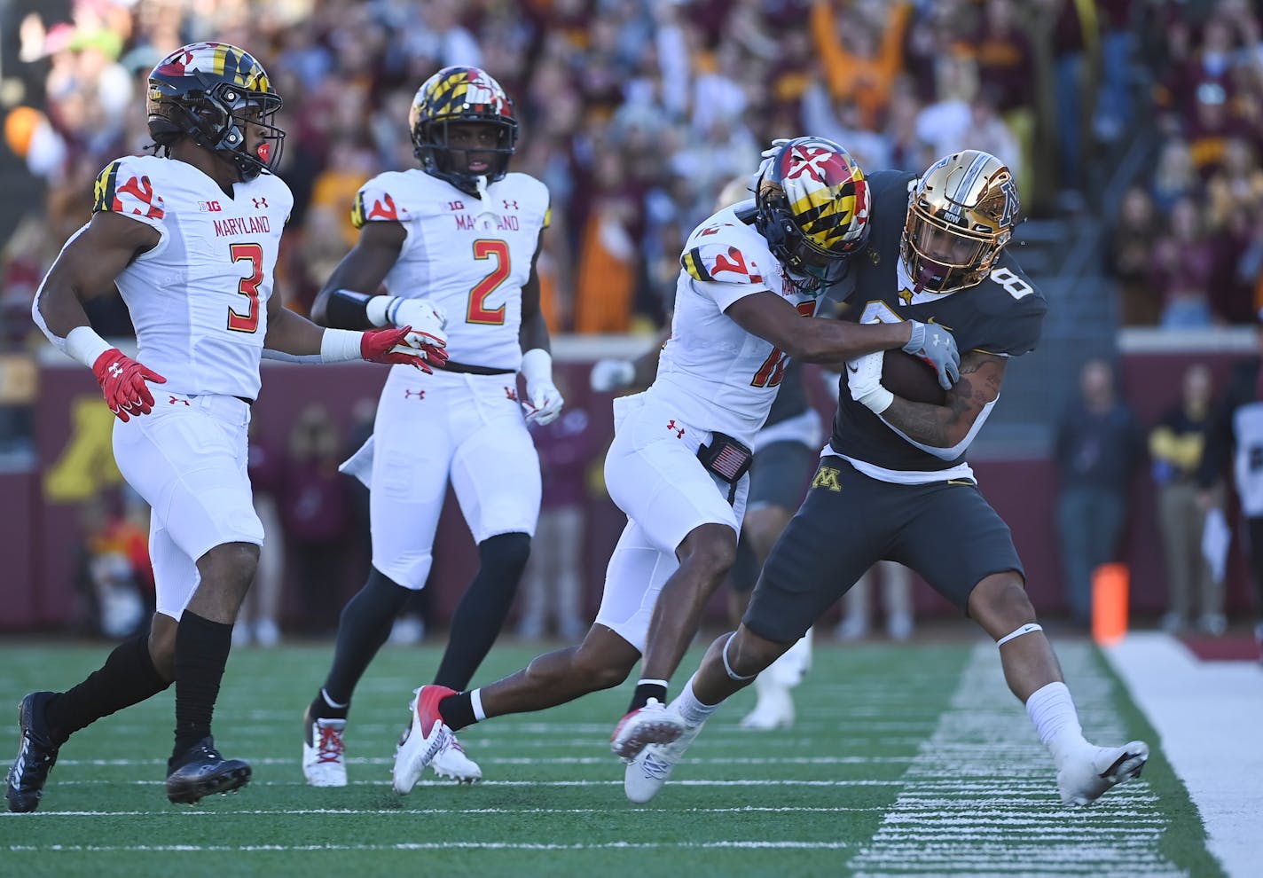 Minnesota Gophers running back Ky Thomas (8) was forced out of bounds by Maryland Terrapins defensive back Tarheeb Still (12) after running for a first down during the first quarter of a football game between the University of Minnesota Gophers and the Maryland Terrapins Saturday, Oct. 23, 2021 at Huntington Bank Stadium in Minneapolis, Minn. ] AARON LAVINSKY • aaron.lavinsky@startribune.com